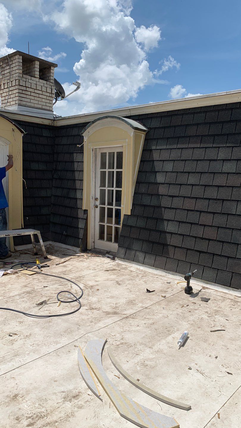 Mansard Charm by Bayfront Roofing and Construction