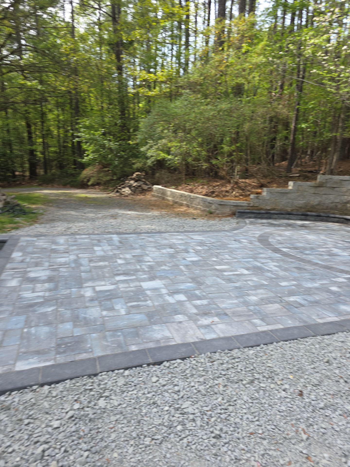 Pittsboro Outdoor Living Transformation – Retaining Wall, Paver Patio & Elevated Deck by Elite Remodeling and Design LLC