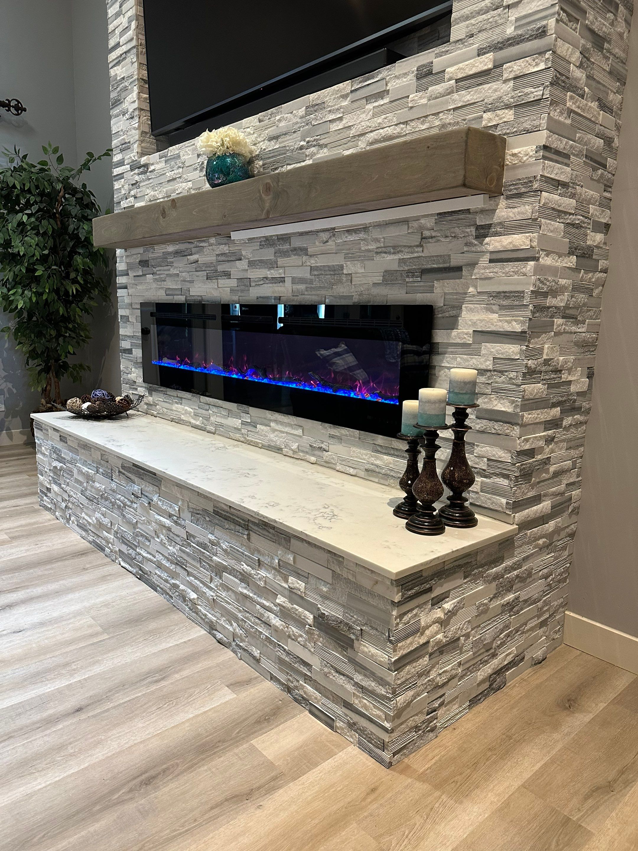 Stacked Stone Electric Fireplace by Footprints Floors of Chandler 