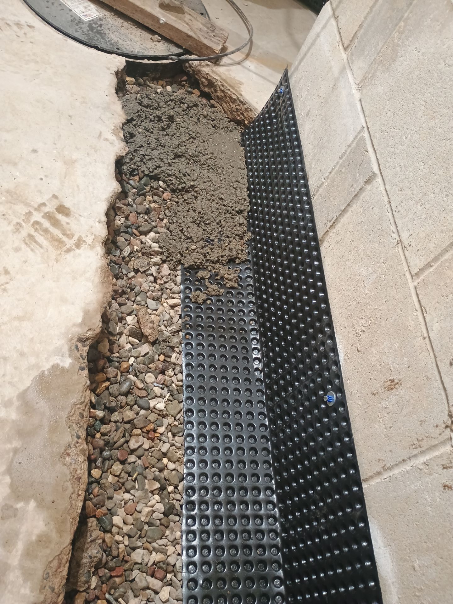 Interior Drain Tile Installation in Minnetonka, MN by Waterproofing Northeast