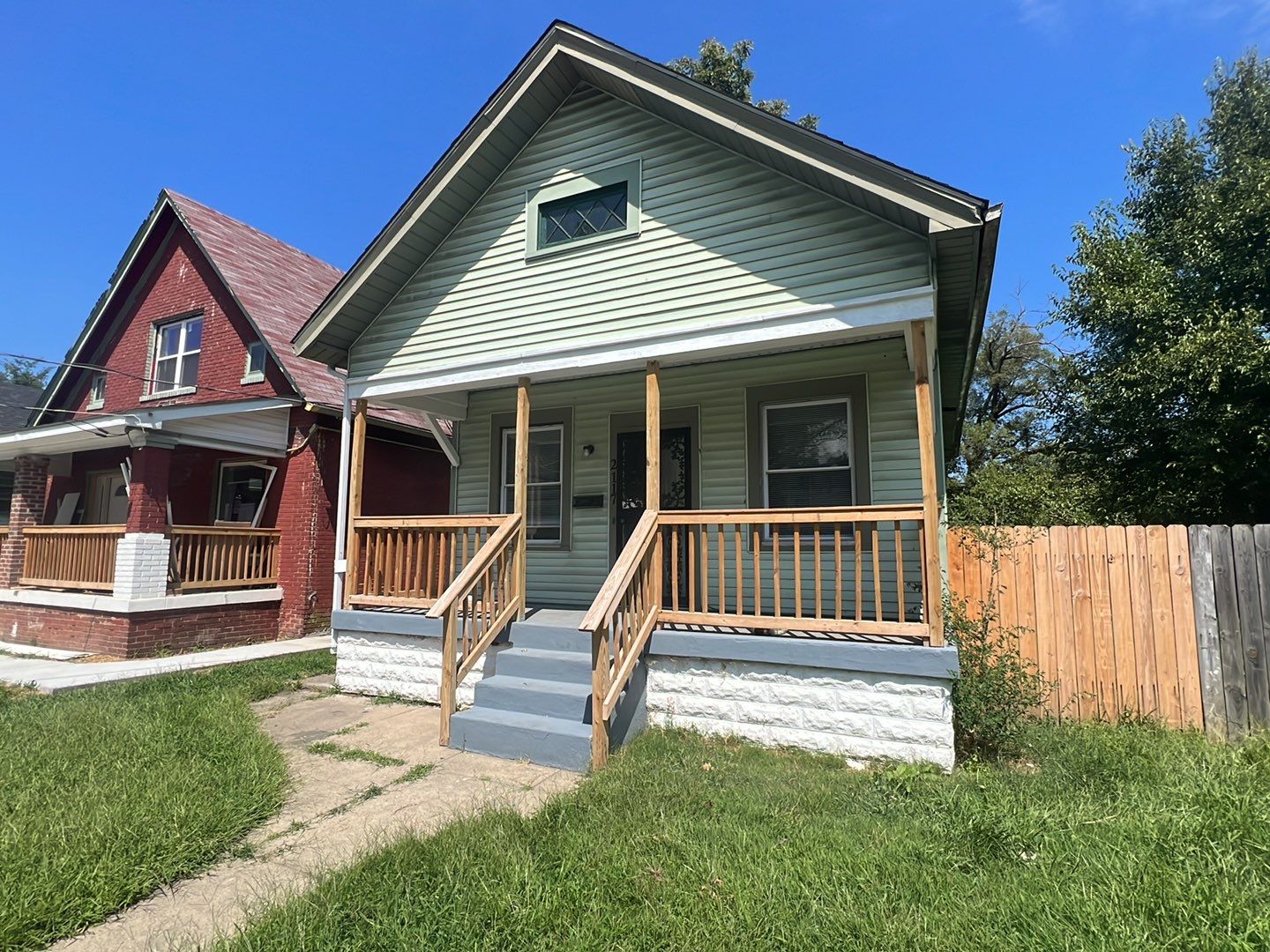 Rental Property Restoration, siding, flooring, gutters, landscaping by Storm Contracting 