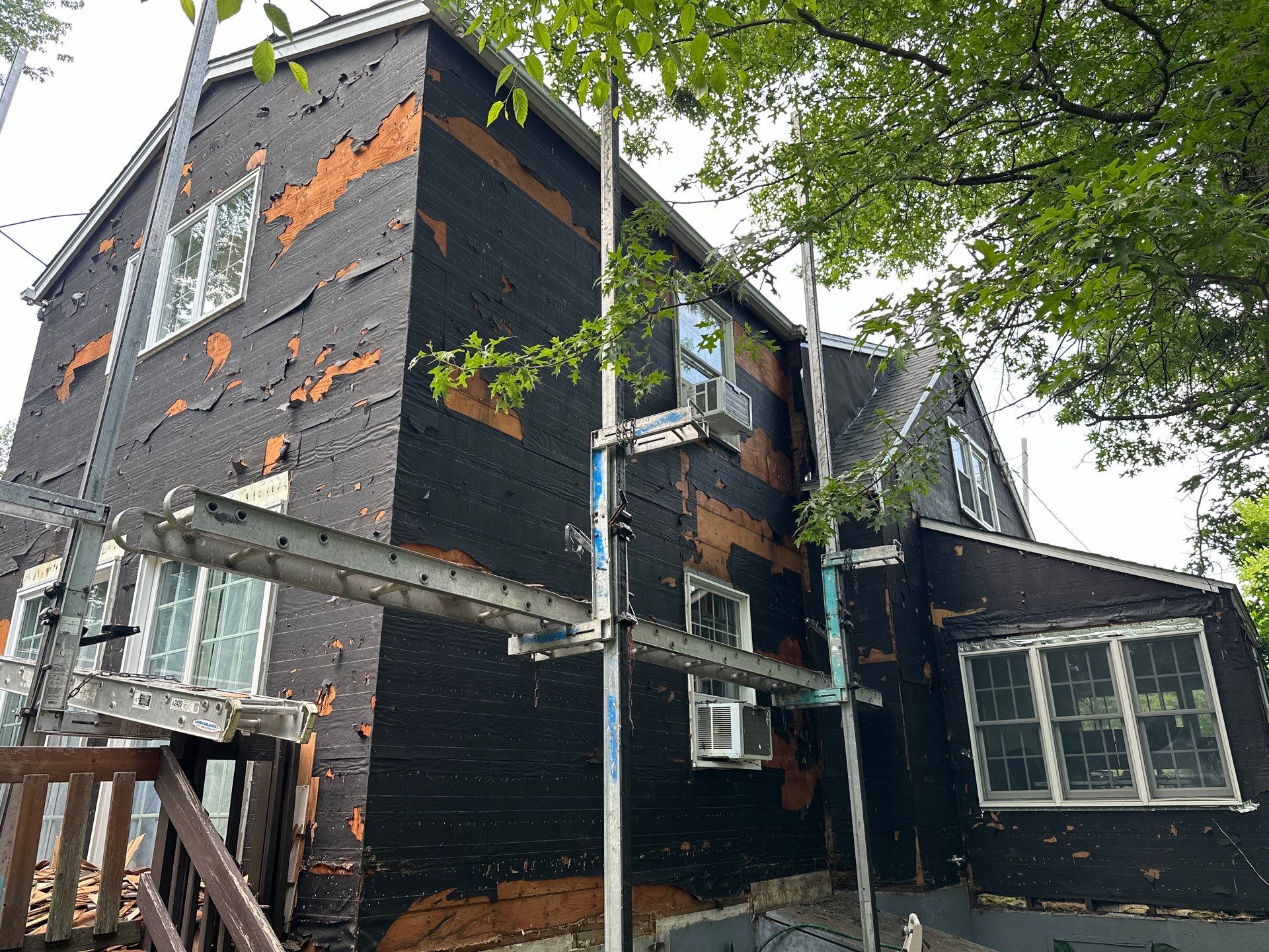 Complete Exterior Estate gray with Pacific Blue Siding by A Plus Exterior