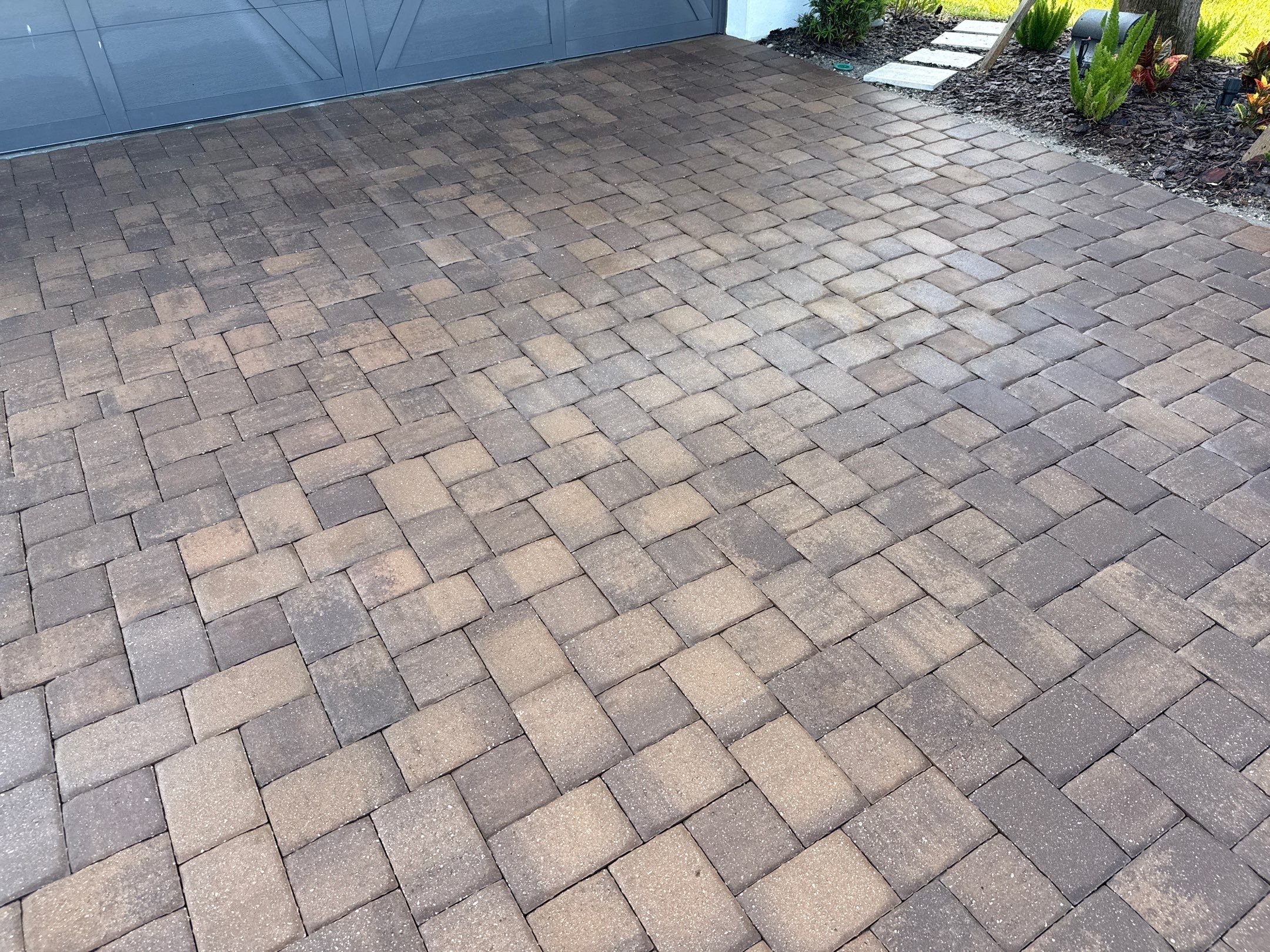 Oil Stain Removal on Paver Driveway | Esplanade at Artisan Lakes, Palmetto FL by Sunshine AquaWash