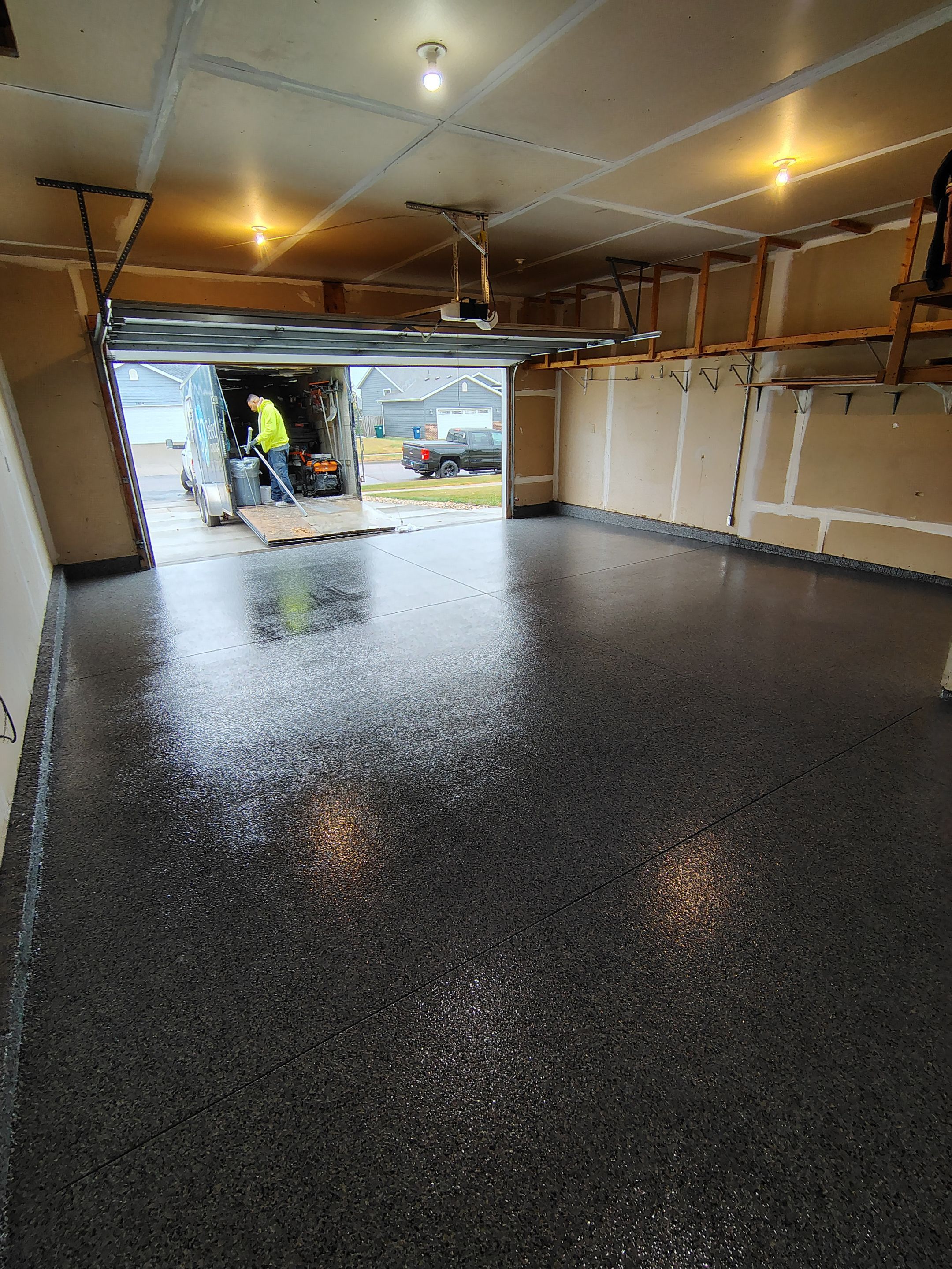 Nightfall Grey Speckled Epoxy Garage Floor Coating in Sioux Falls by Select Painting, Coatings & Garage Cabinets