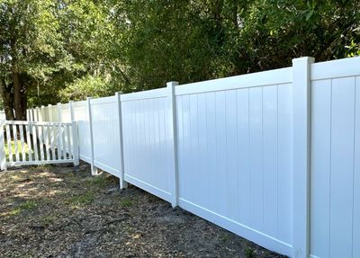 Vinyl Fence Installation using White Vinyl Privacy and Picket Fence