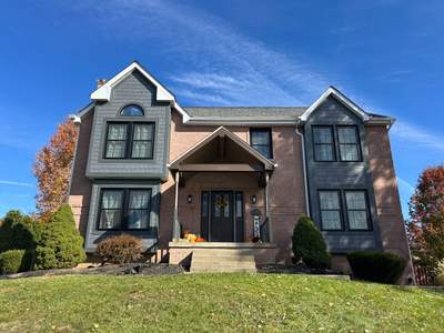 Home Siding Renovation in James Hardie with Iron Gray and Night Gray at Cranberry Township
