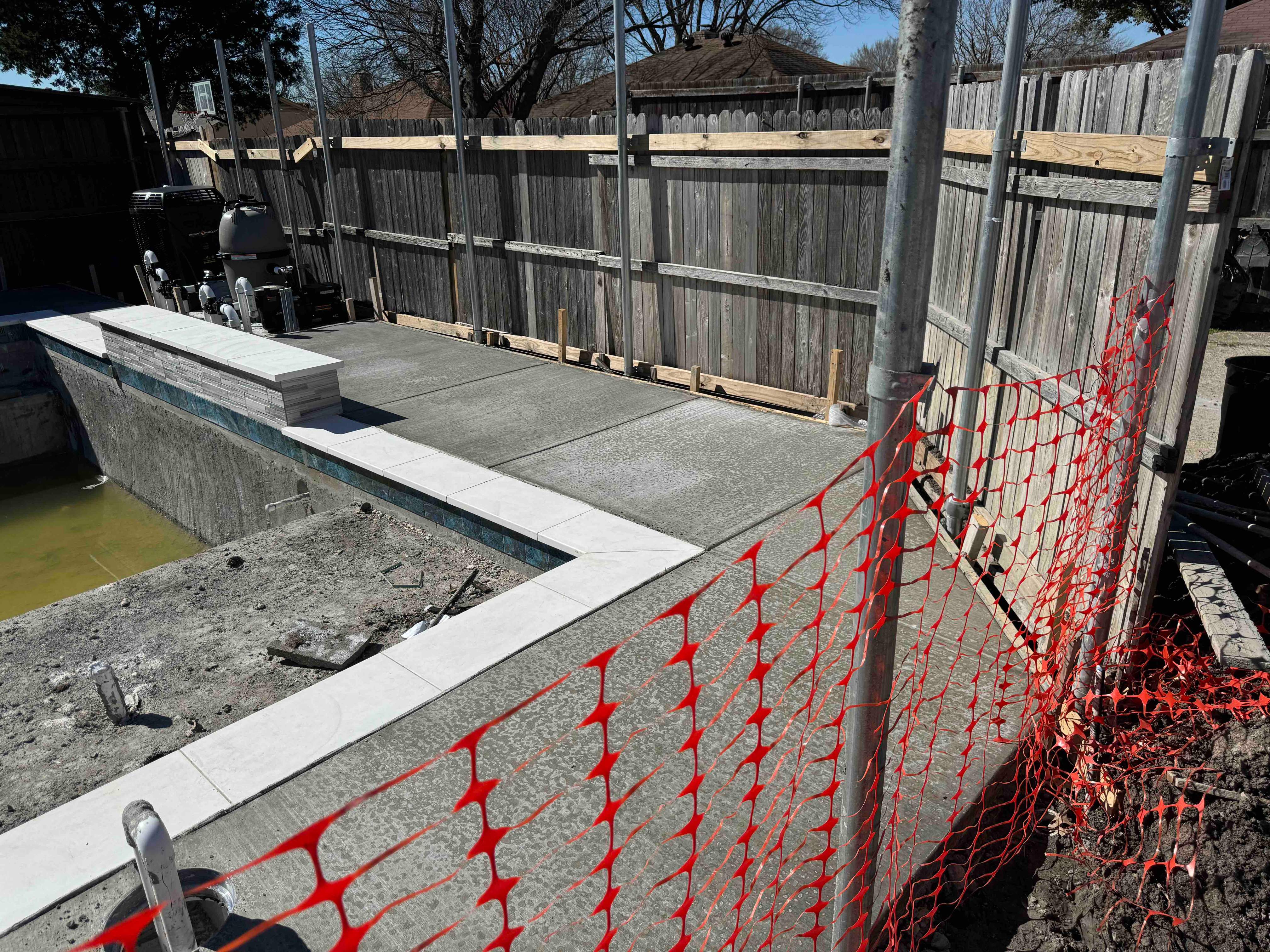Geometric Pool with Raised Spa and Tanning Ledge by Pinnacle Pools and Spas - DFW