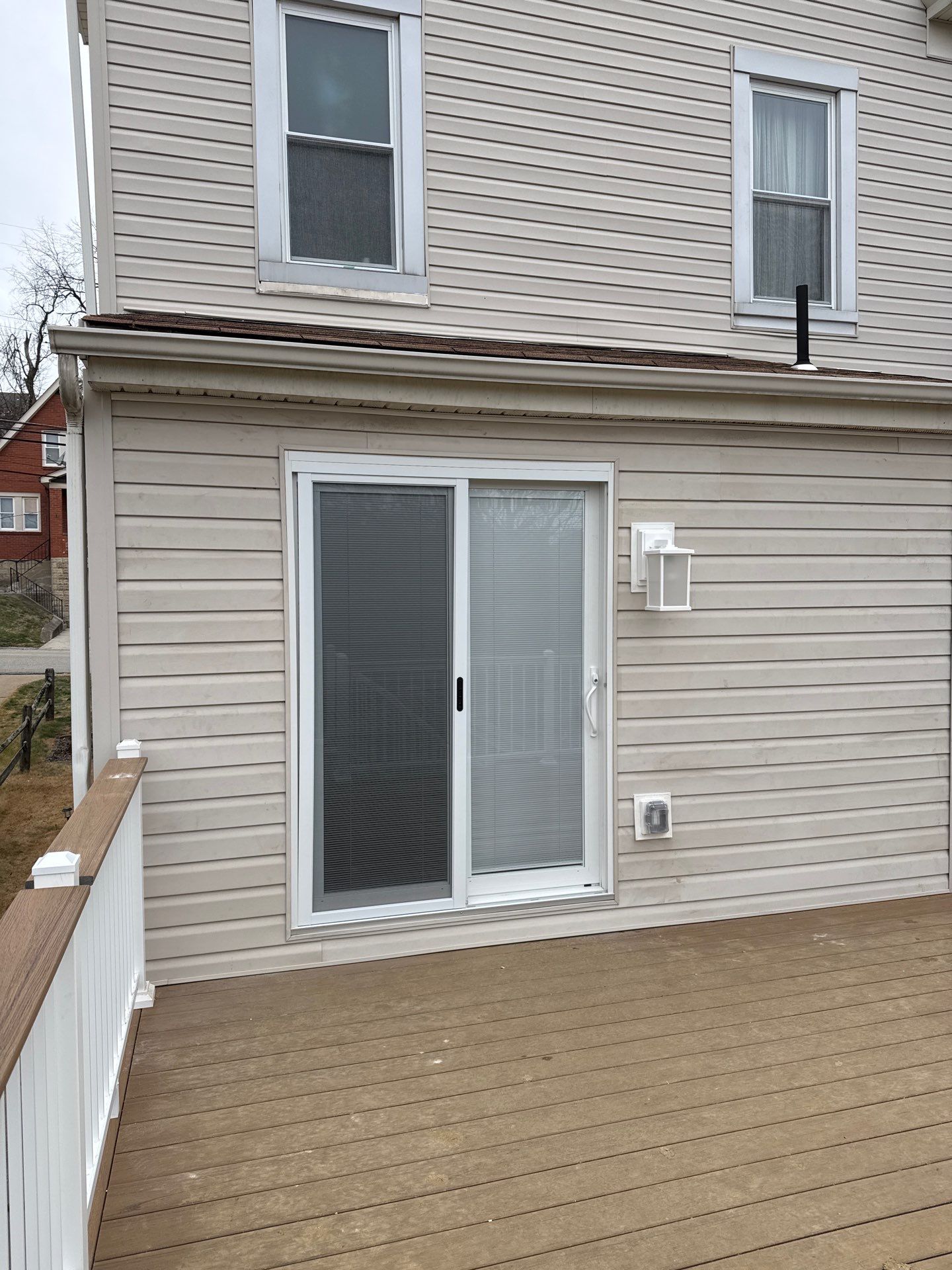 Deck and door by Cousins Roofing Siding & Decks