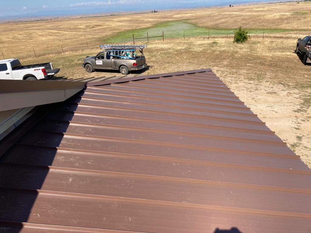 Metal roofing installation using Standing seam metal roofing system by Straight Edge Roofing Inc
