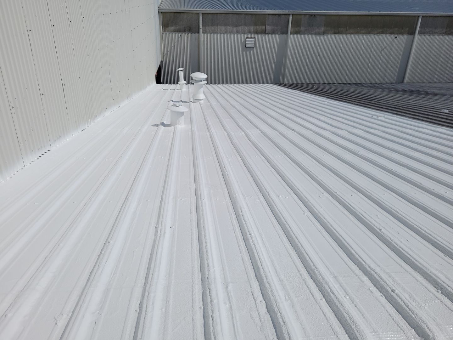 Commercial Metal Restoration System using Aldocoat Coatings by Hostetler Roofing