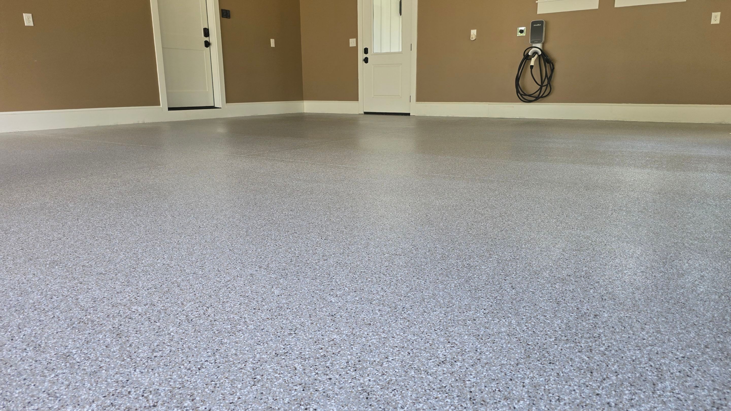 Front Porch & Garage Using Creekbed by Elite Floor Solutions