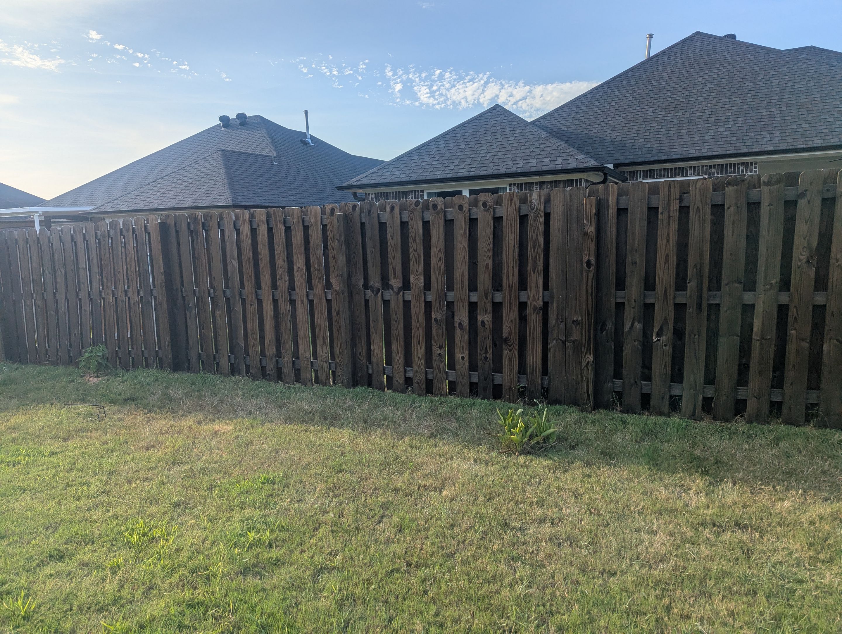 Touching Up a Fence in Whitehouse by Quality Coats Painting