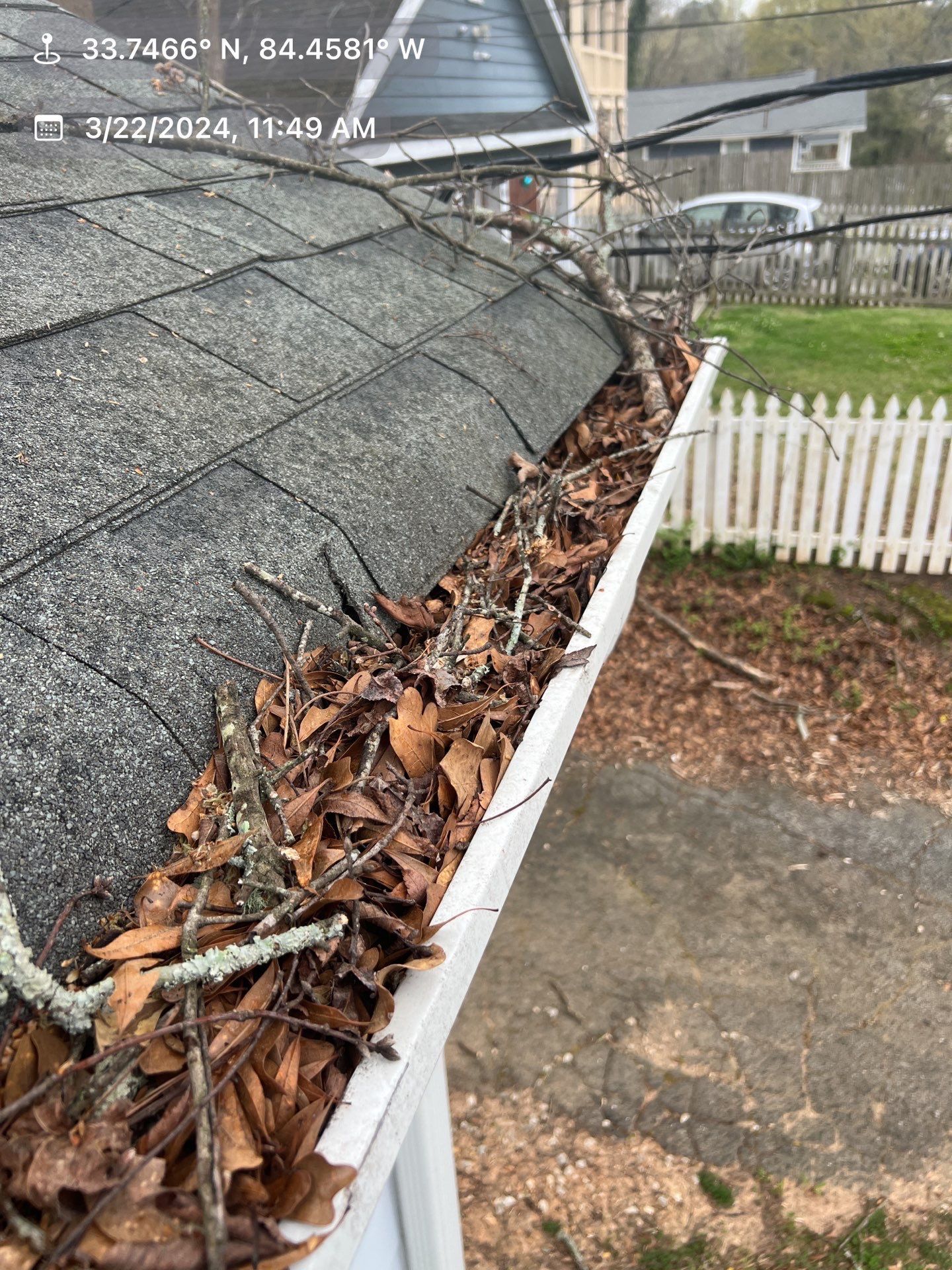 Gutter Cleaning using brown bags by Roof Bullies