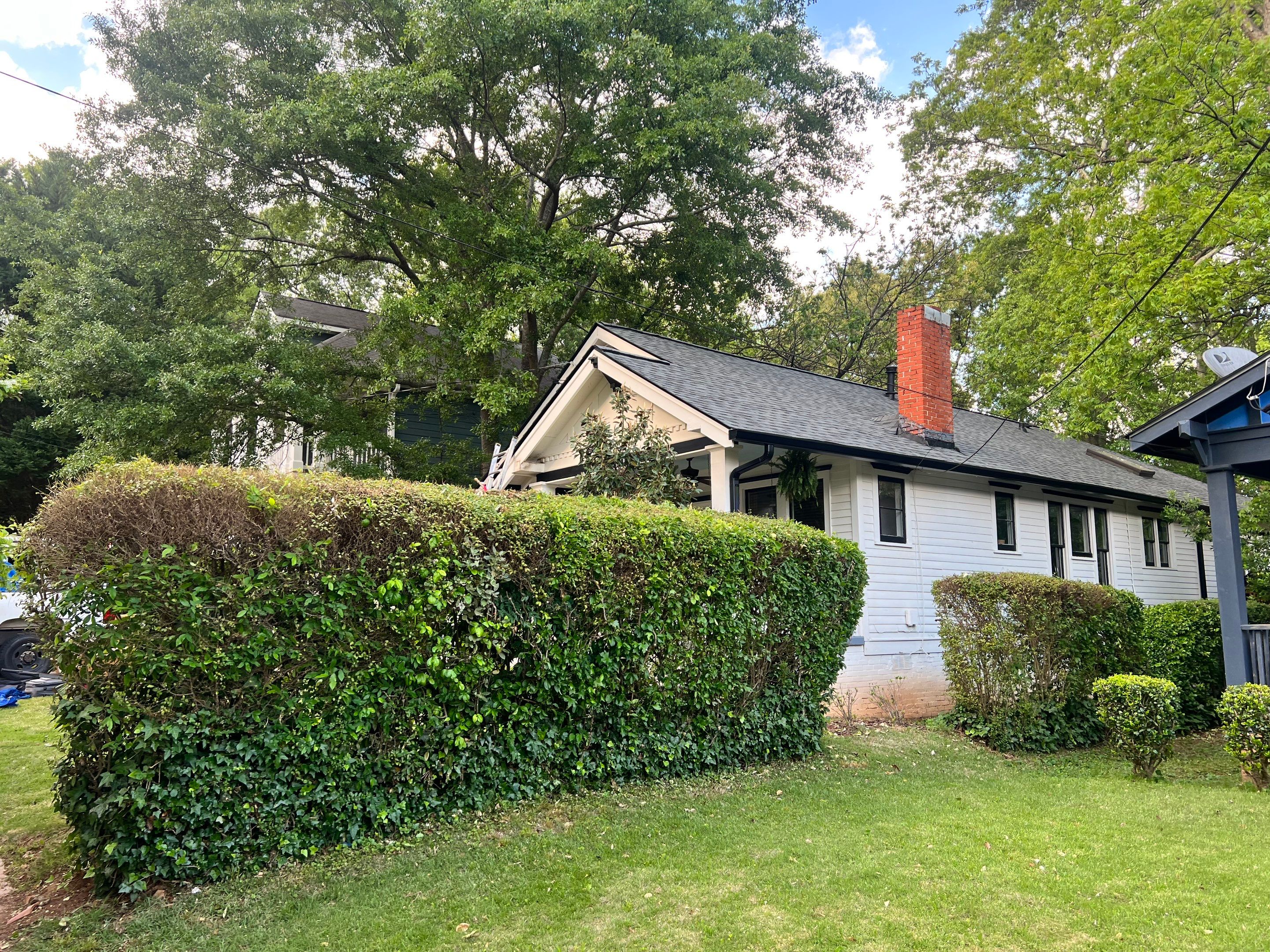 roof replacement and new black gutters by Nailed It Roofing & Remodeling LLC