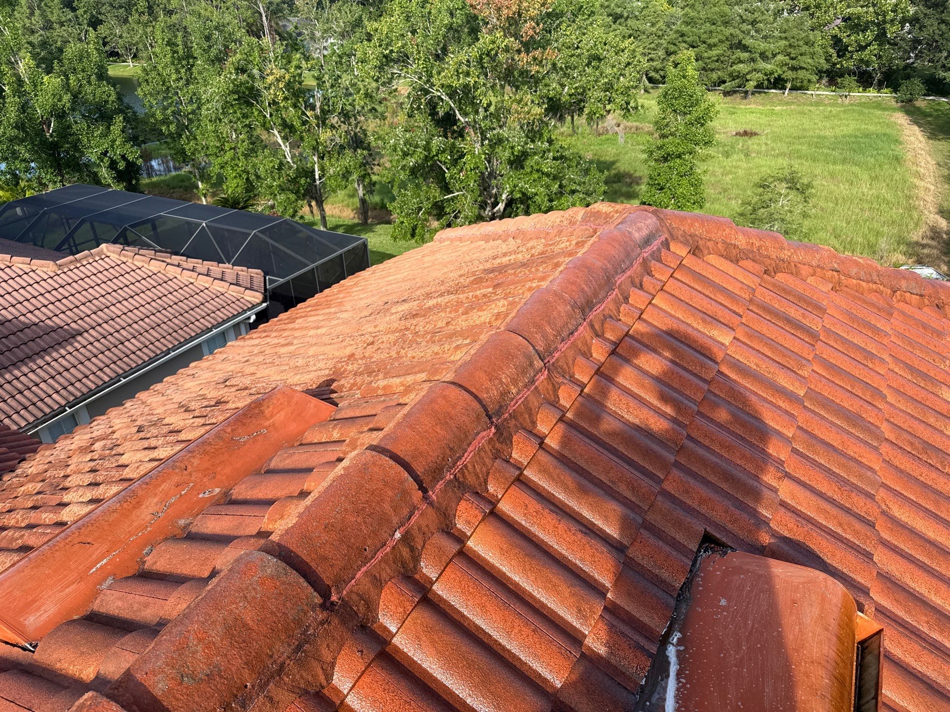 Soft Wash Tile Roof Cleaning in Sonoma Community, Sarasota, FL by Sunshine AquaWash