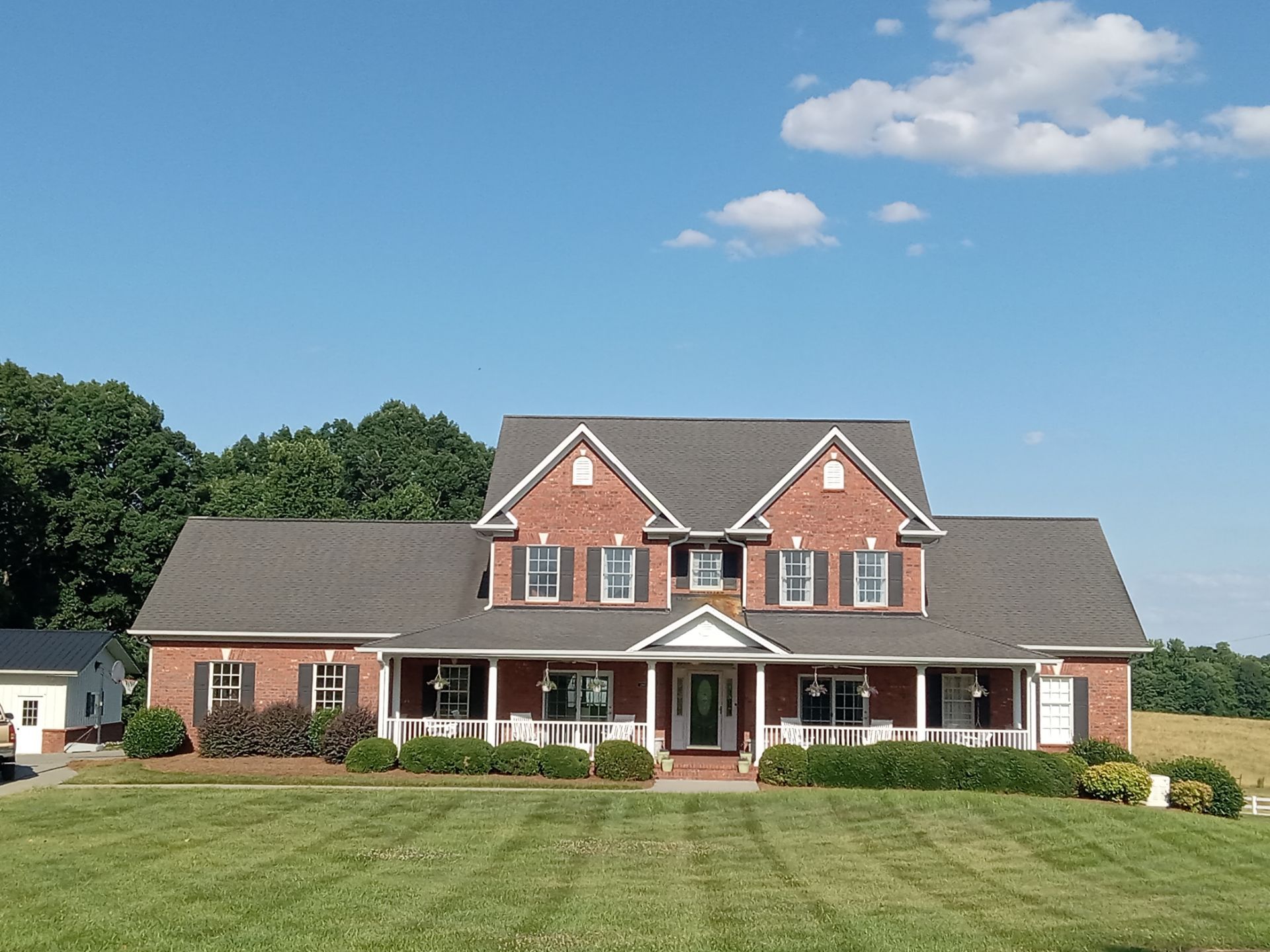 pressure washing house exterior siding driveway walkways to remove dirt grime mold for clean and maintained appearance