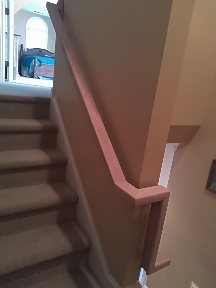 Stairway Installation using Red oak modern railings by House Custom Carpentry, LLC