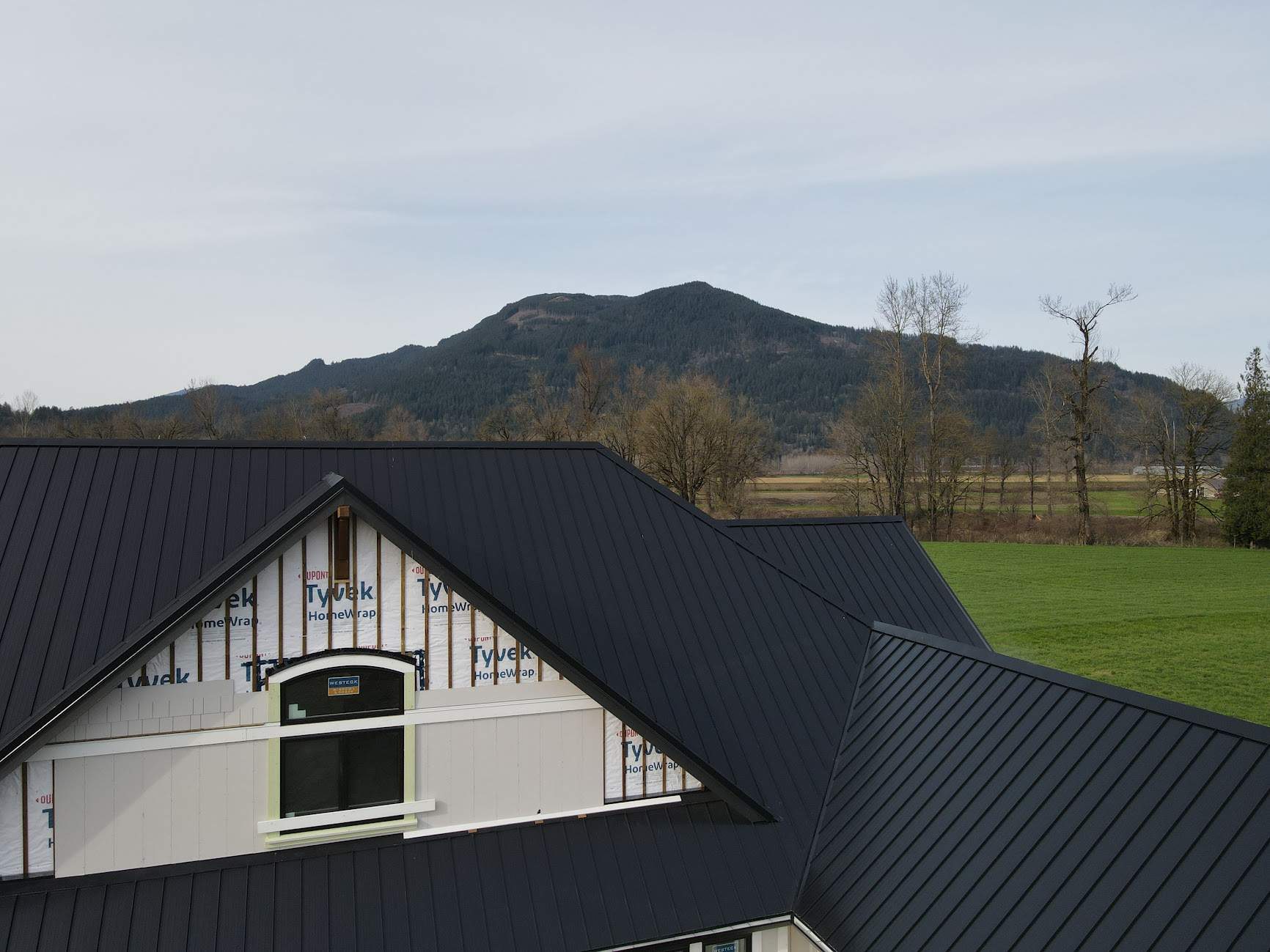 Residential Roofing Installation using 12" Prolok metal  by Top Notch Roofing Inc