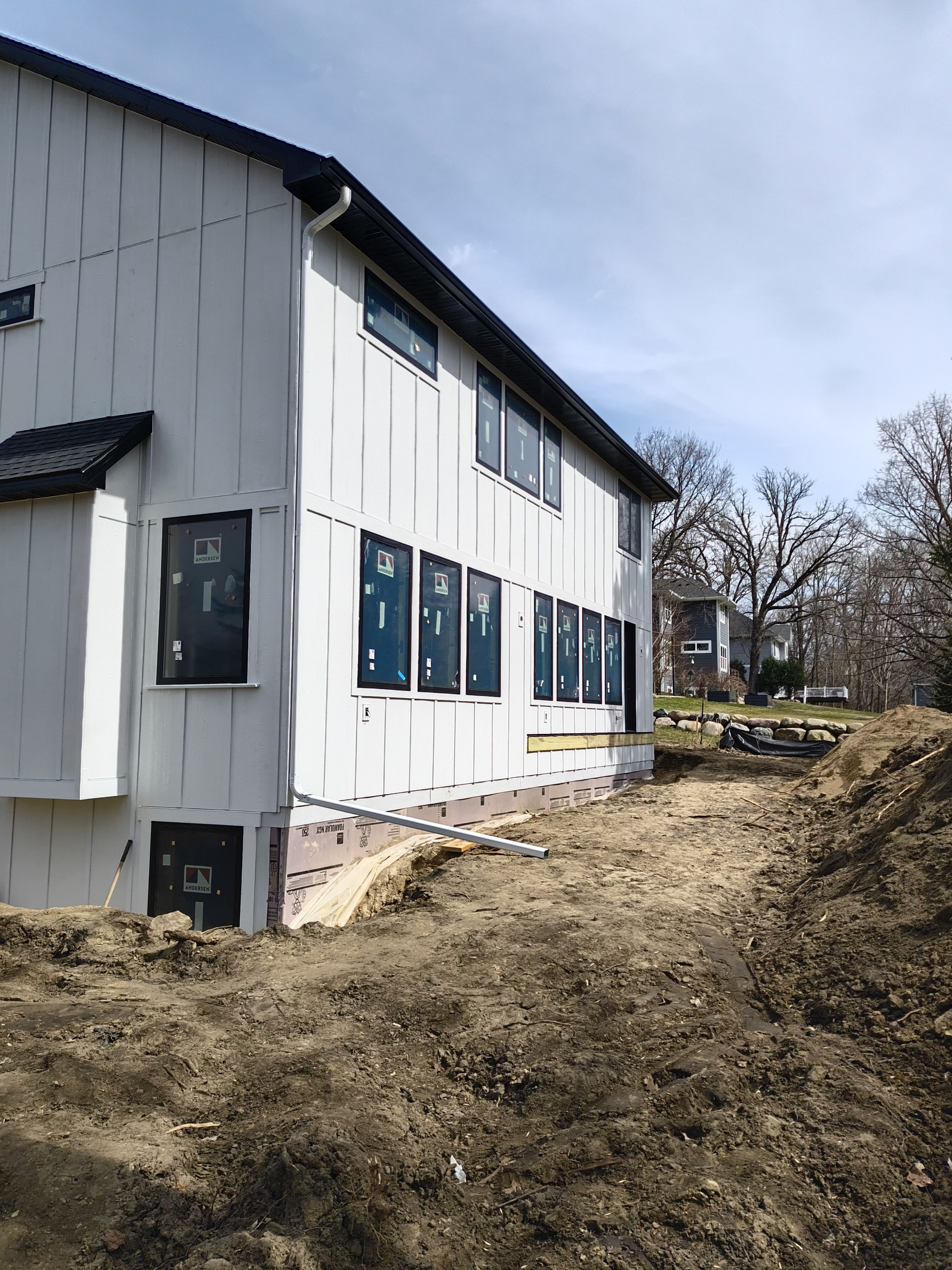 Black Seamless Gutter Installation for New Excelsior Home Build by Next Level Seamless Gutters / Exteriors Inc.
