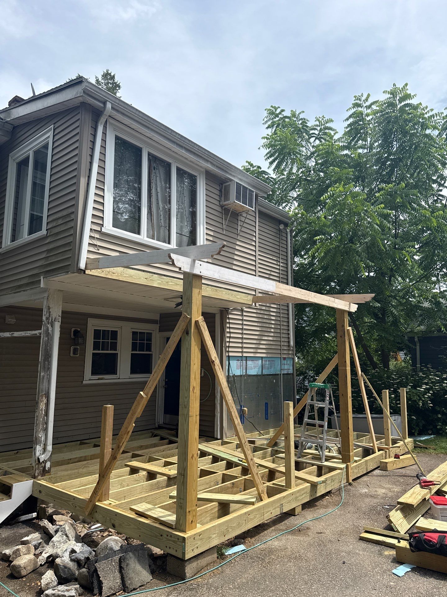 new deck with custom pergola by CabralCarpentry & Painting LLC