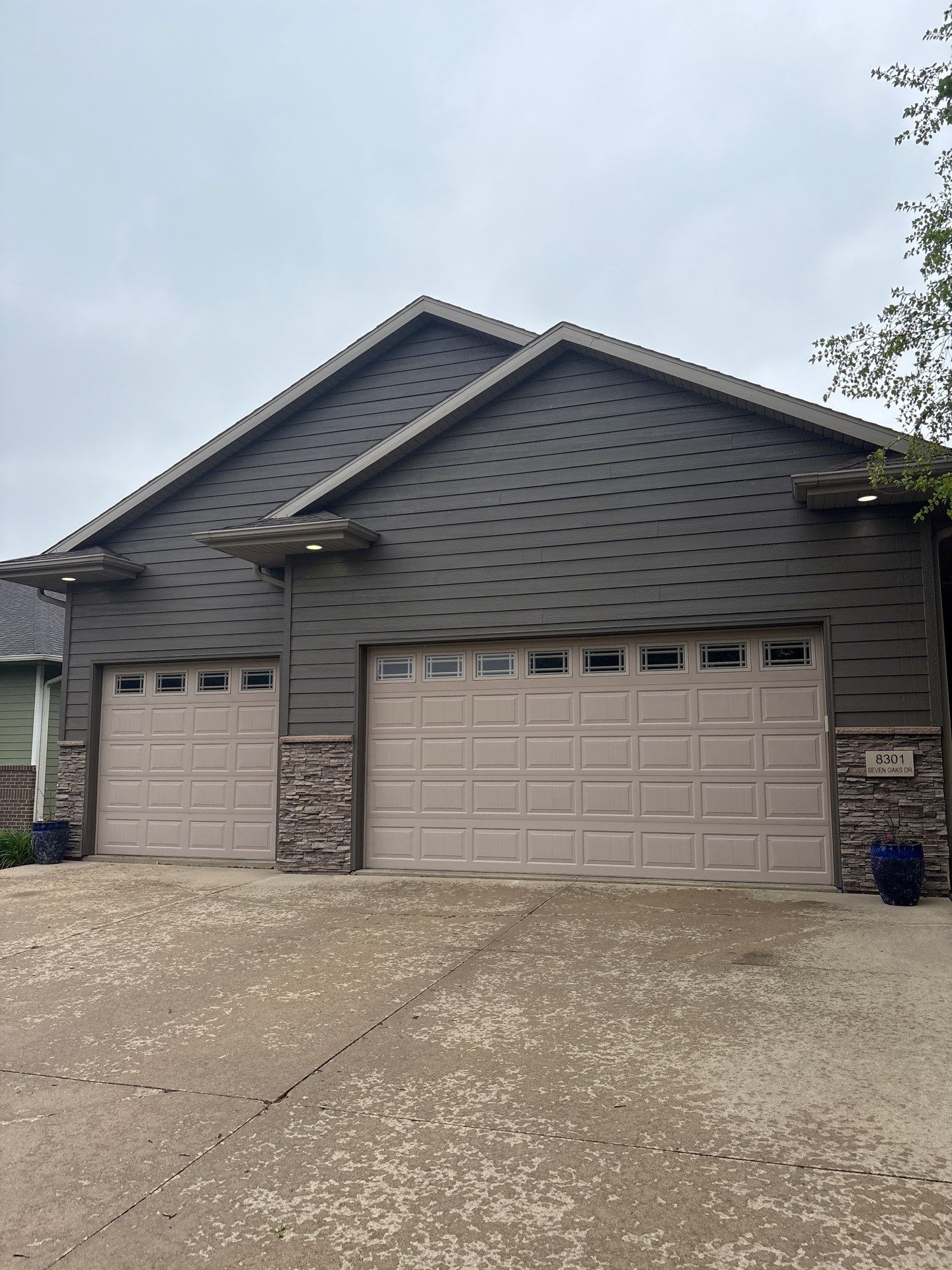 Sioux Falls Residential Exterior Update and Flagstone Pool Deck by Select Painting, Coatings & Garage Cabinets