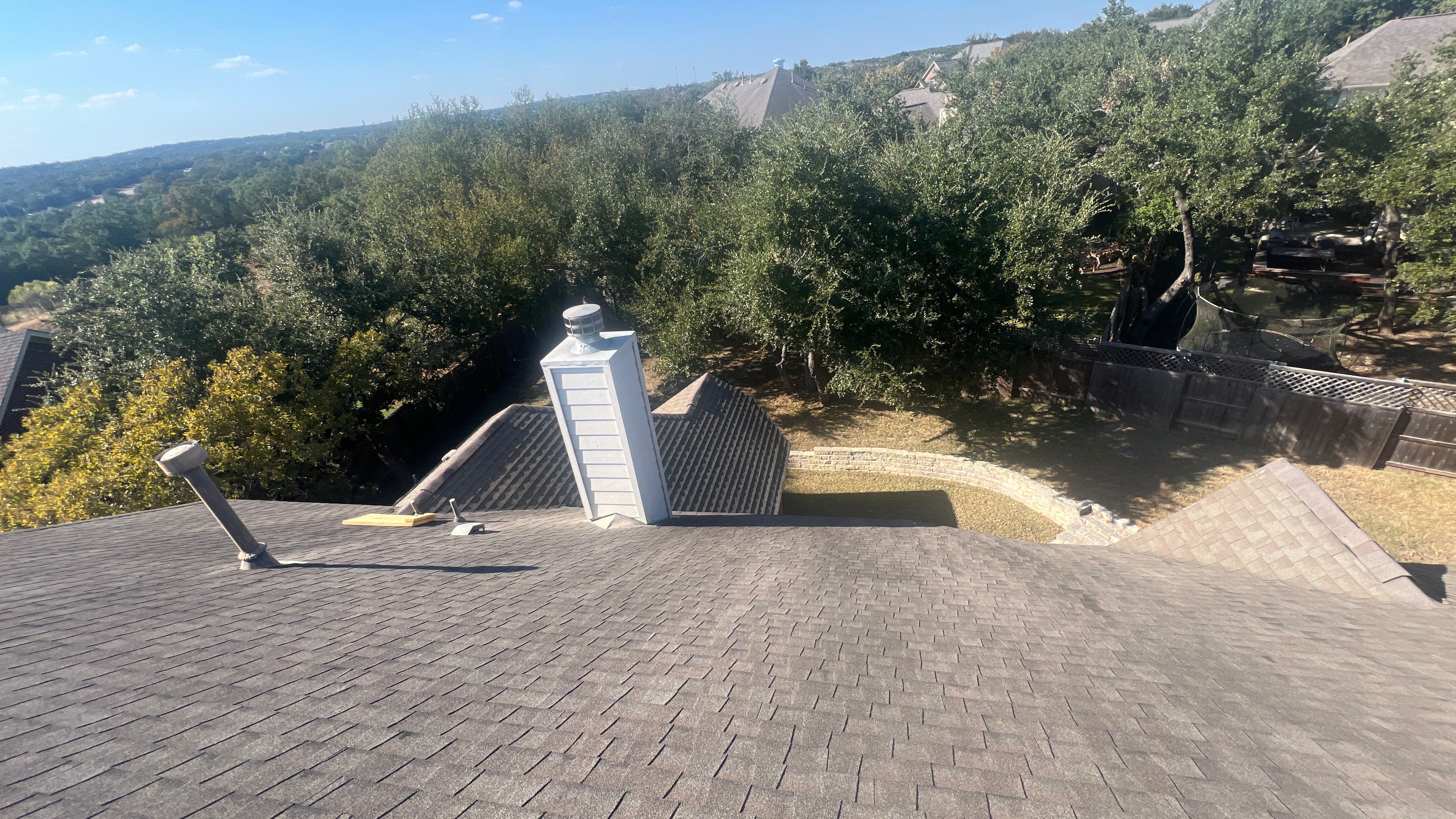 Asphalt Shingle Roof Replacement and Storm Damage Restoration in Austin by Caliber Restoration LLC