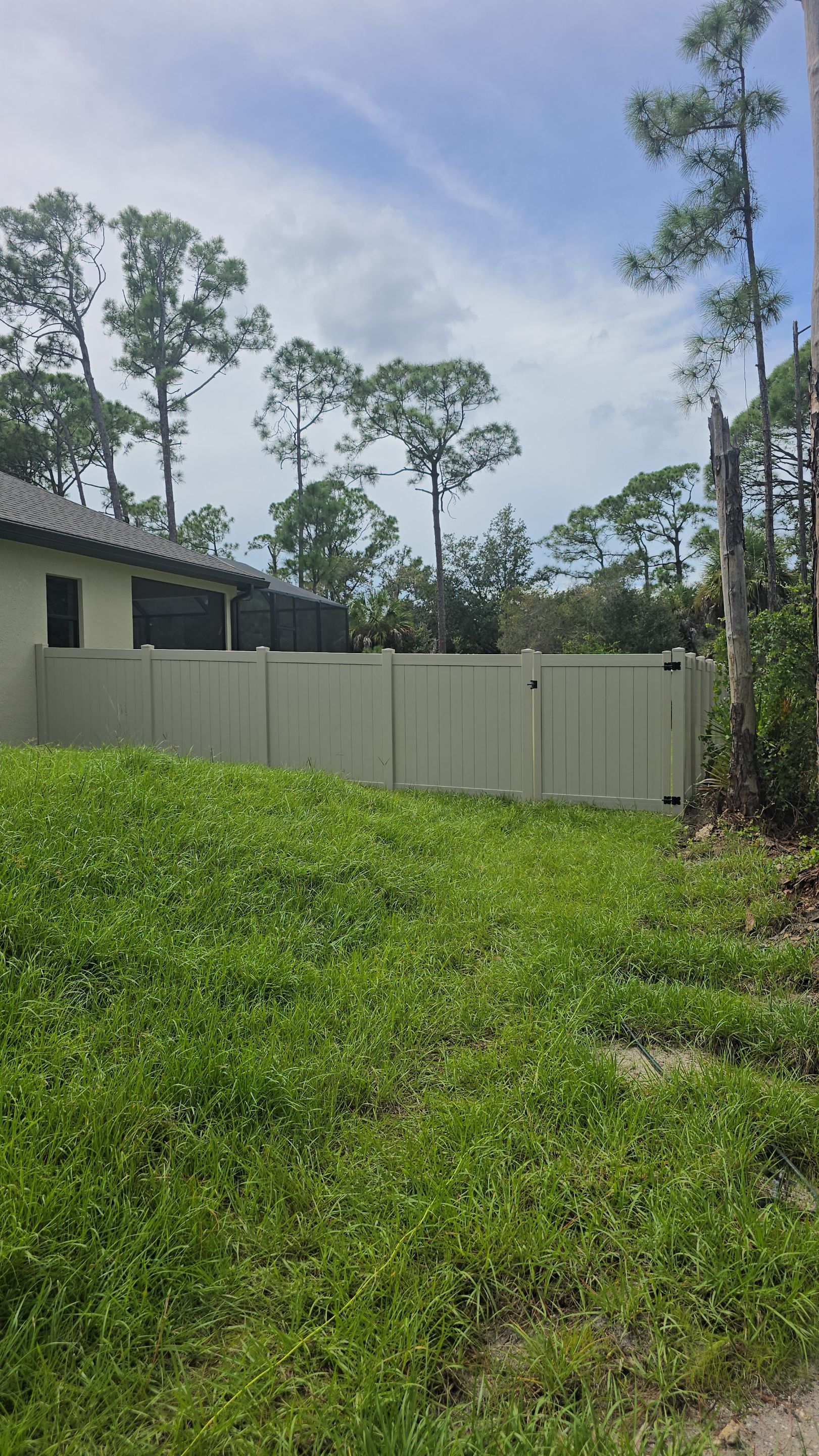 Tan Vinyl Privacy Fence and Gate Installation in Port Charlotte by True Fence LLC