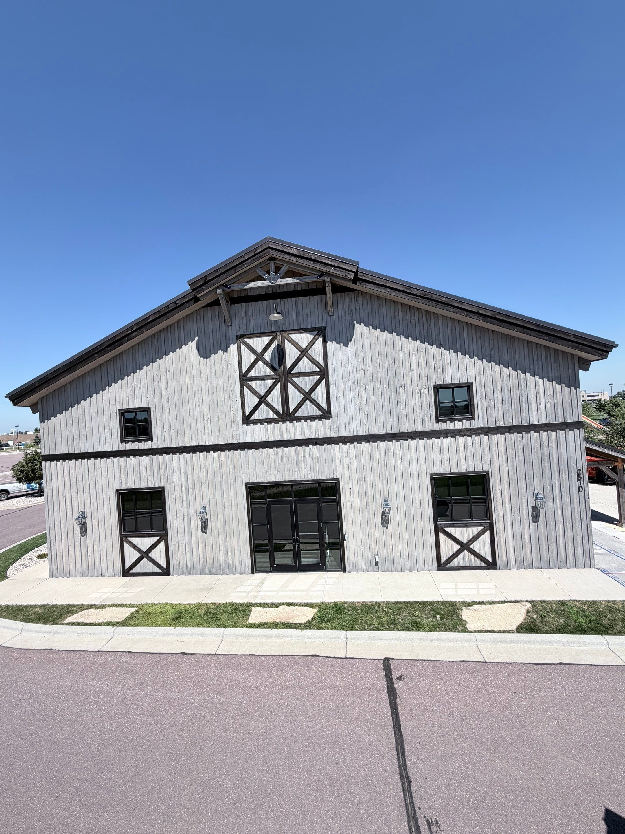 Commercial Exterior Wood Staining for Sanford Barn in Sioux Falls by Select Painting, Coatings & Garage Cabinets