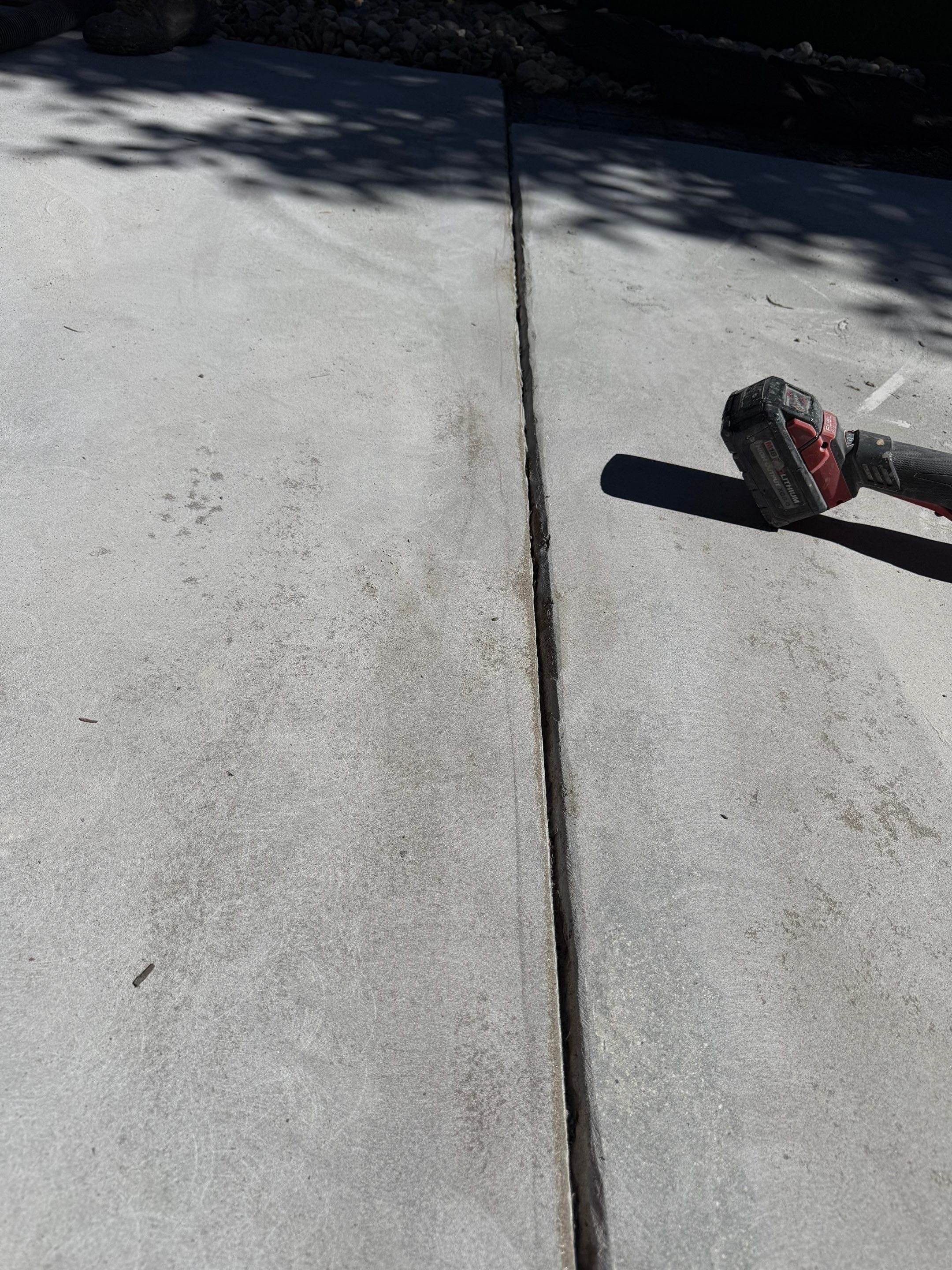 Textured Concrete Coating and Paver Patio Refresh in Sioux Falls by Select Painting, Coatings & Garage Cabinets