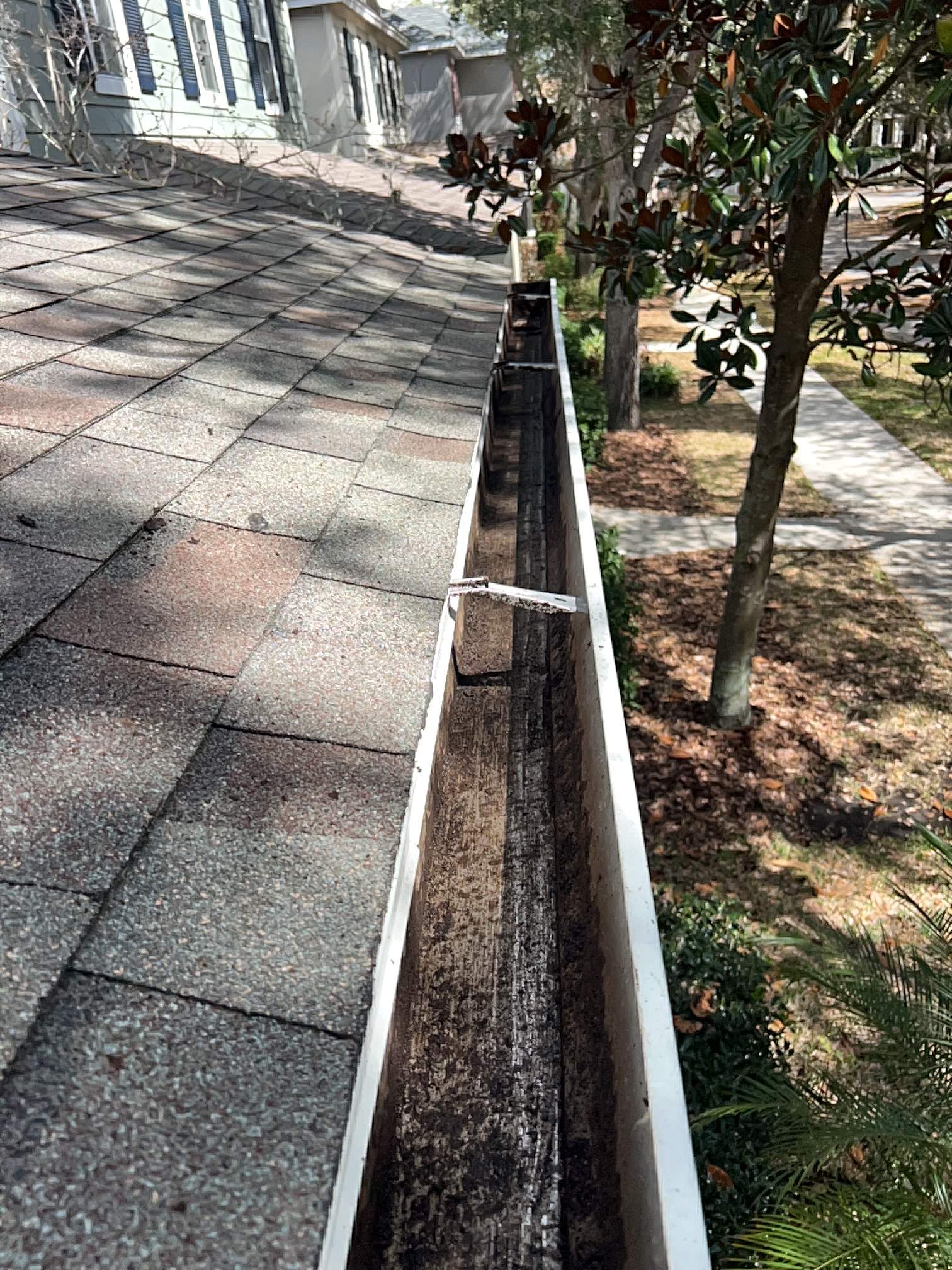 Residential gutter cleaning after photo showing a fully cleaned gutter.