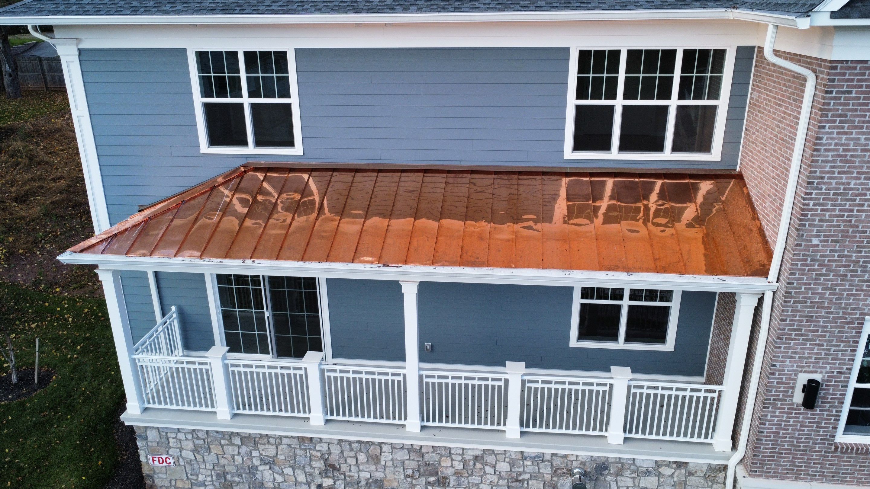 Standing Seam Metal Roof using Copper by CMNG LLC