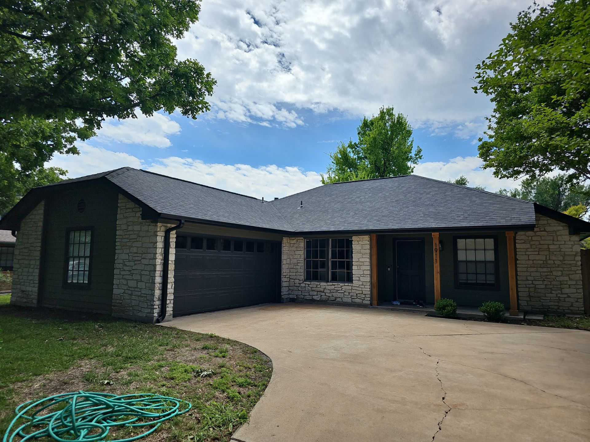 Residential Roofing Installation using Owens Corning Oakridge Onyx Black by DeZign Roofing & Exteriors