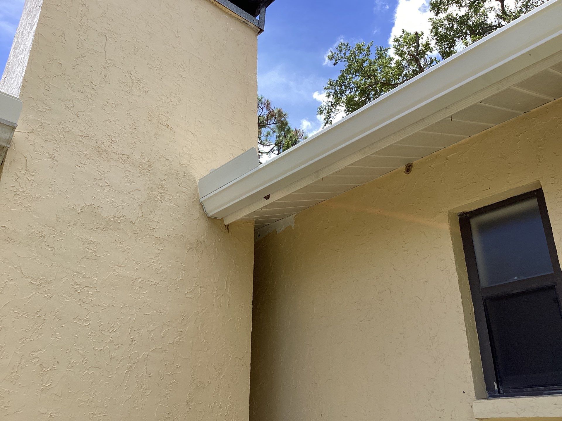New Soffit and Fascia and White Gutters  by Gutter Professors