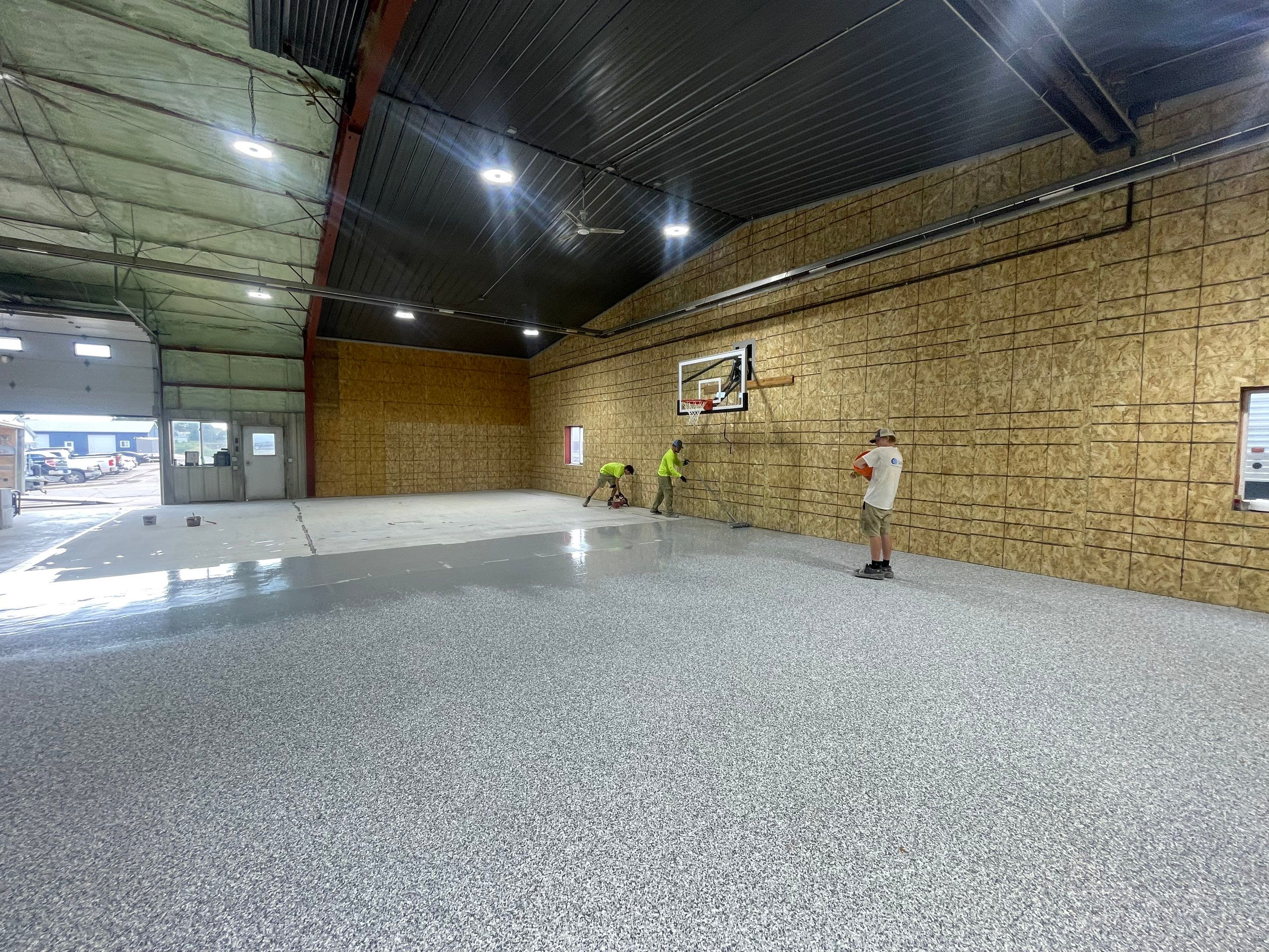 Custom Polyurea Shop Floor with Basketball Court Lines in Rock Valley by Select Painting, Coatings & Garage Cabinets