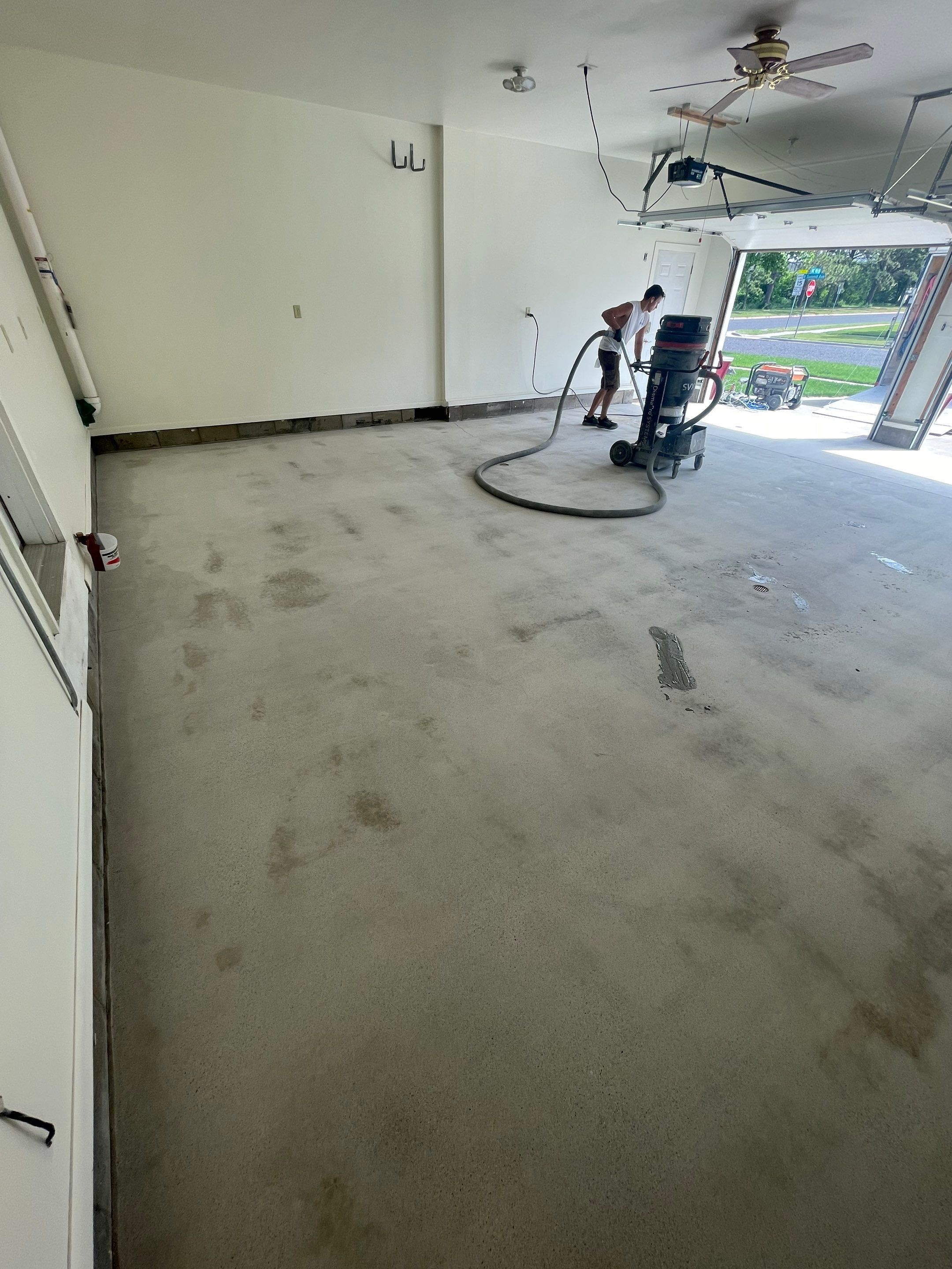 Madison Garage Concrete Coating with Feather Grey Speckle Finish by Select Painting, Coatings & Garage Cabinets