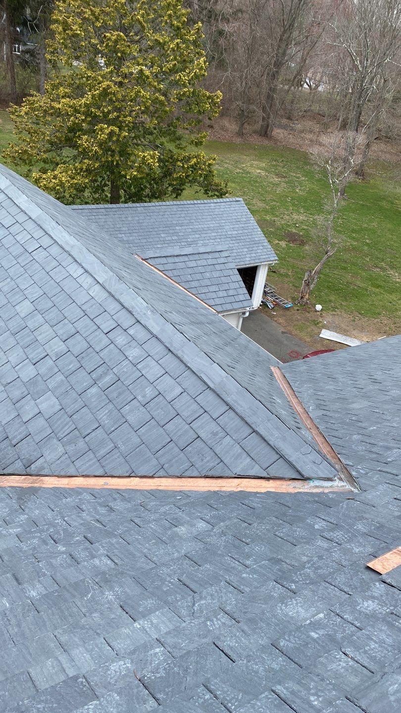 Residential Roofing Installation using Vermont Slate by A Plus Exterior