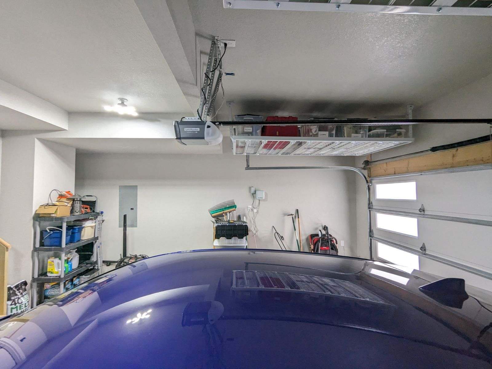 John H. maximized his storage with overhead racks and wall shelves by Banner Garage