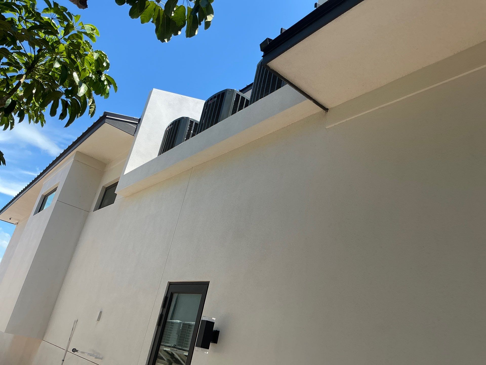 Seamless Aluminum Gutter Installation using black seamless gutters in Sarasota FL by Gutter Professors