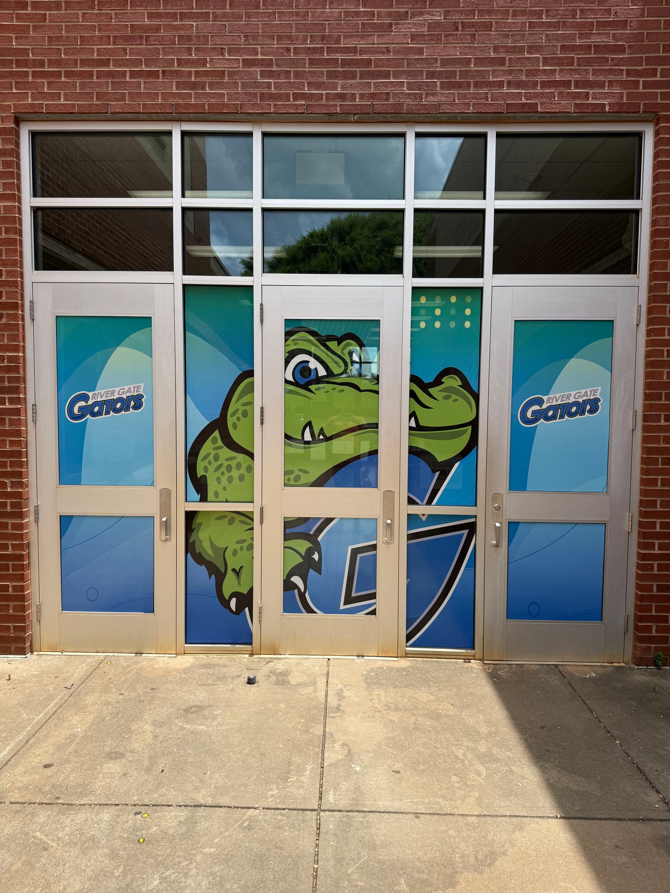 Rivergate Elementary - Window Safety Film Installation with Custom Graphics by QC Signs and Graphics