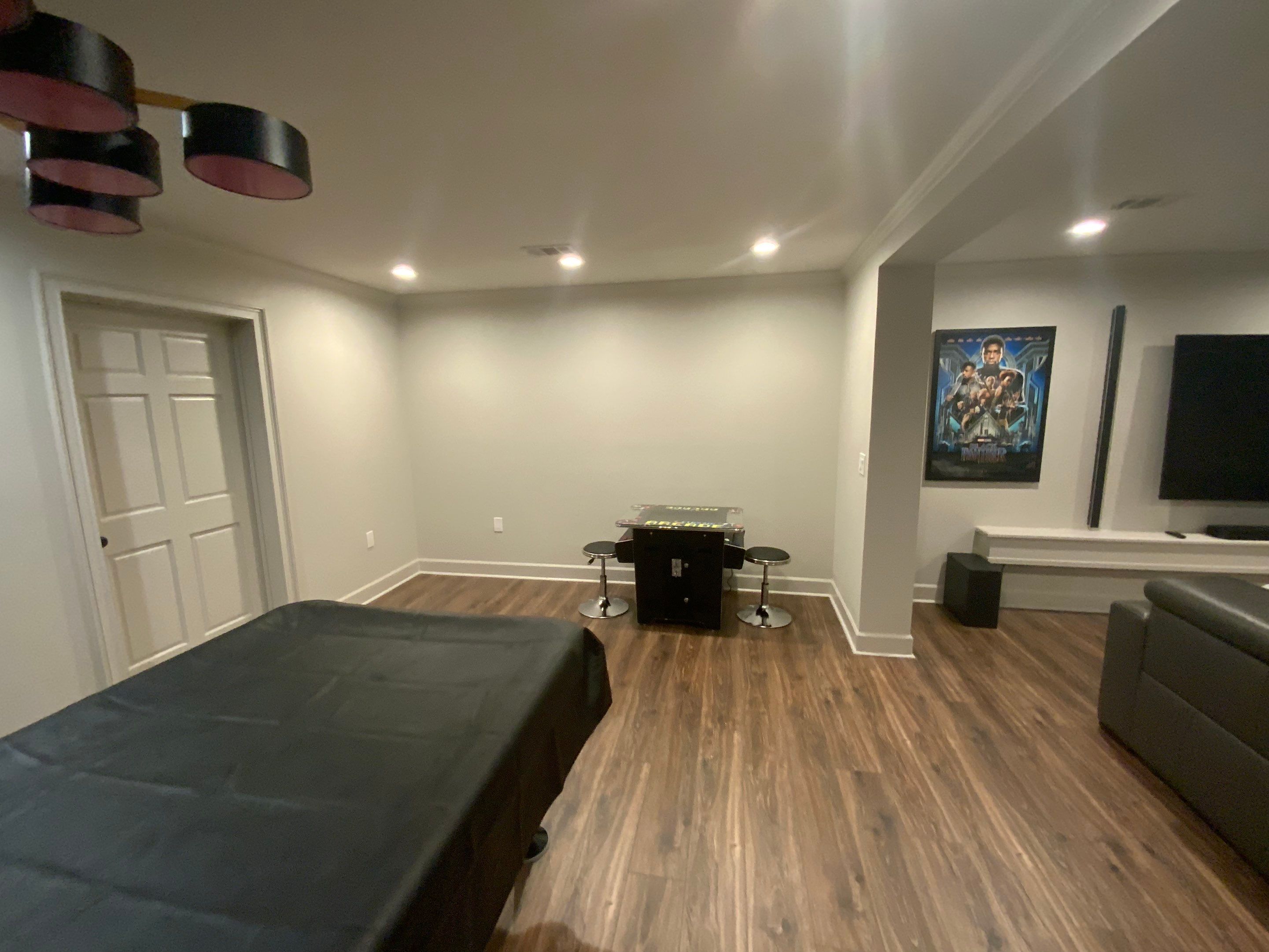 Finished Basement Renovation Featuring Home Theater and Custom Wine Cellar by Swift Home Renovations