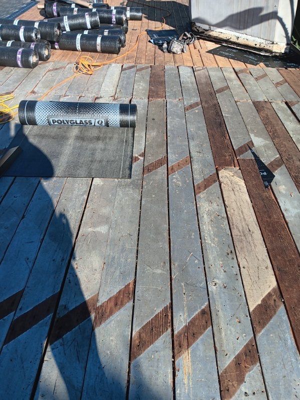 Residential Roofing Installation using Polyfresko® G Highly Reflective Modified Bitumen Cap Sheet by Hull Brothers Roofing