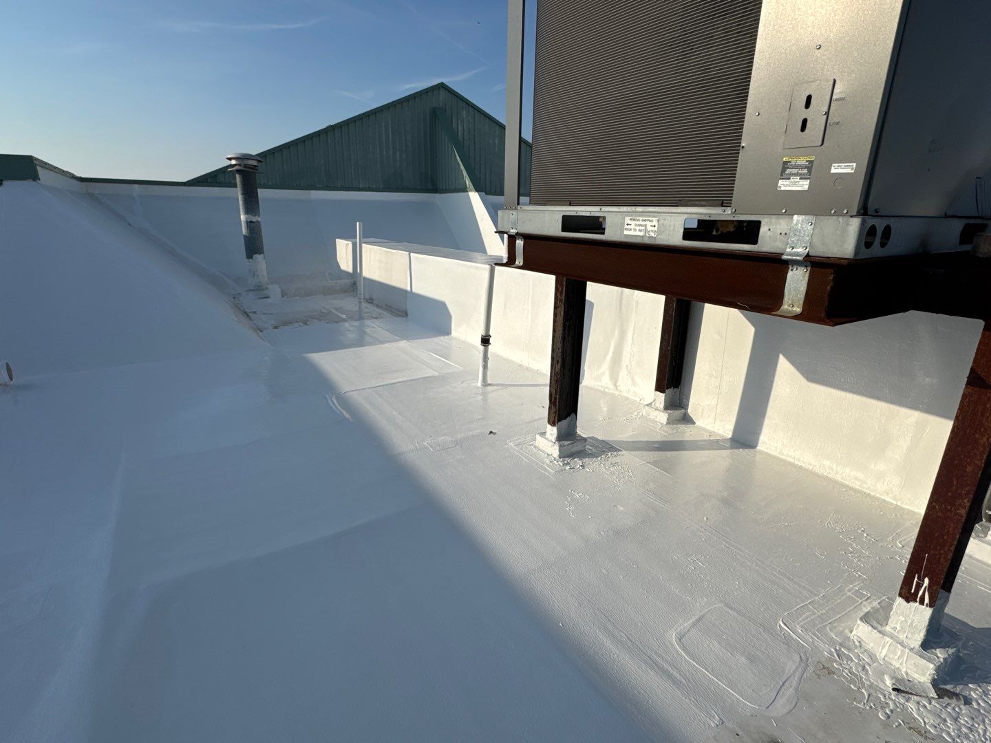 Commercial White Silicone Roof Coating for Hotel in Oldsmar by CES Roofing