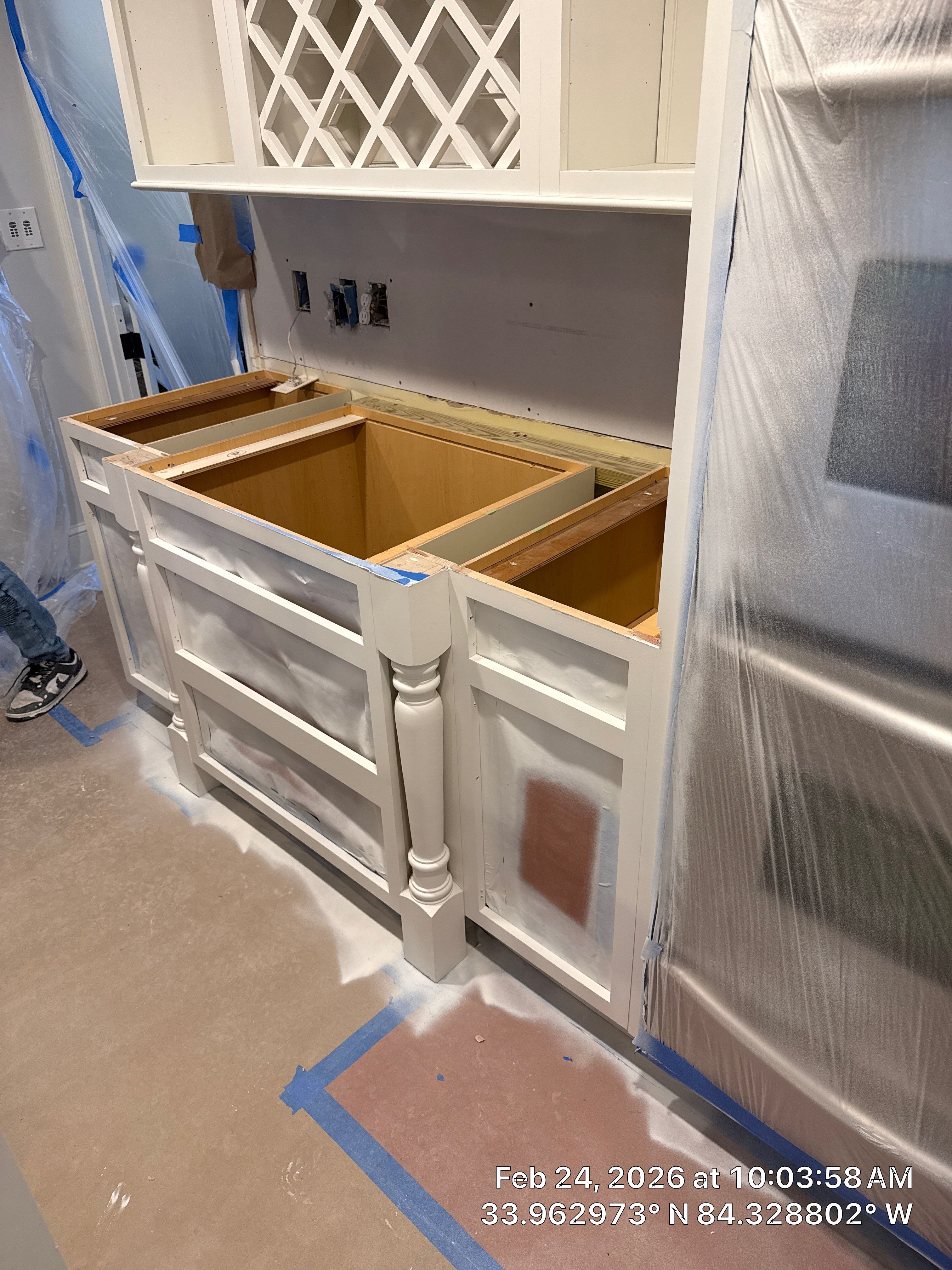 Kitchen Remodel in Dunwoody Featuring White Cabinetry and Blue Island by Heart & Home Kitchen & Bath Remodeling LLC