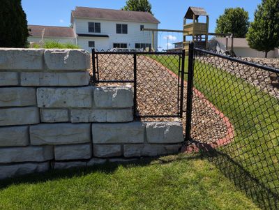 Black Vinyl-Coated Chain Link Fence Installation in Denver