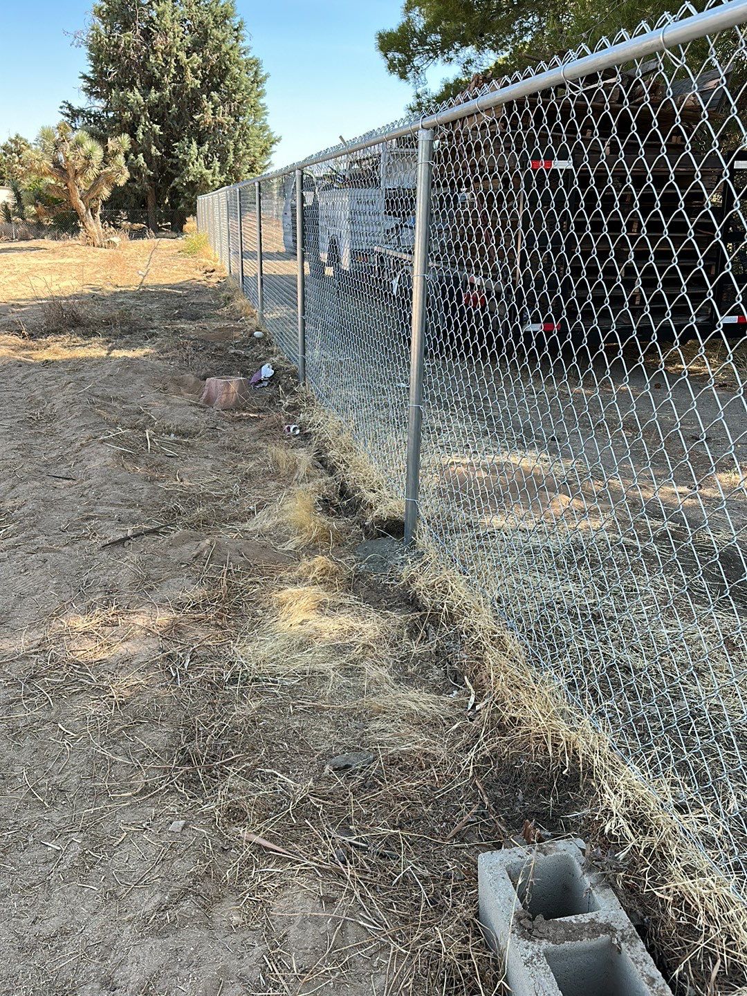 Replaced wood fence with chain link fence.  by Fence Guys Inc. 