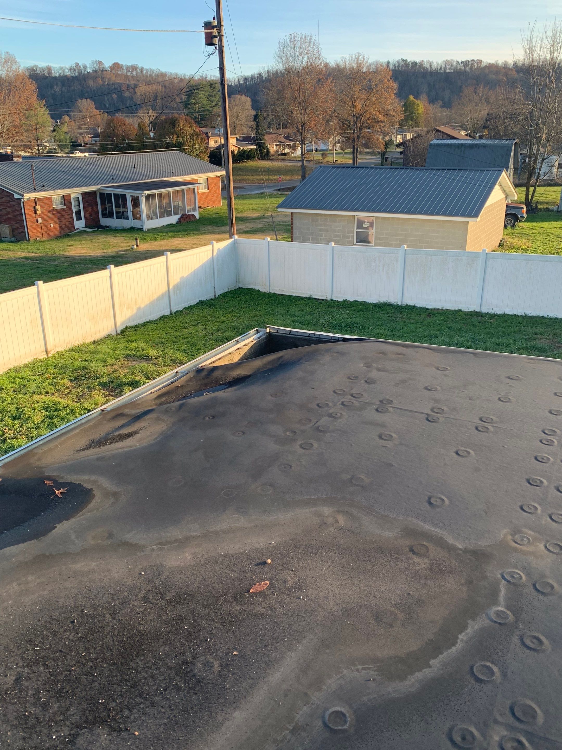 Rubber Roofing  on a residential sunroom by Secure Construction Company Inc