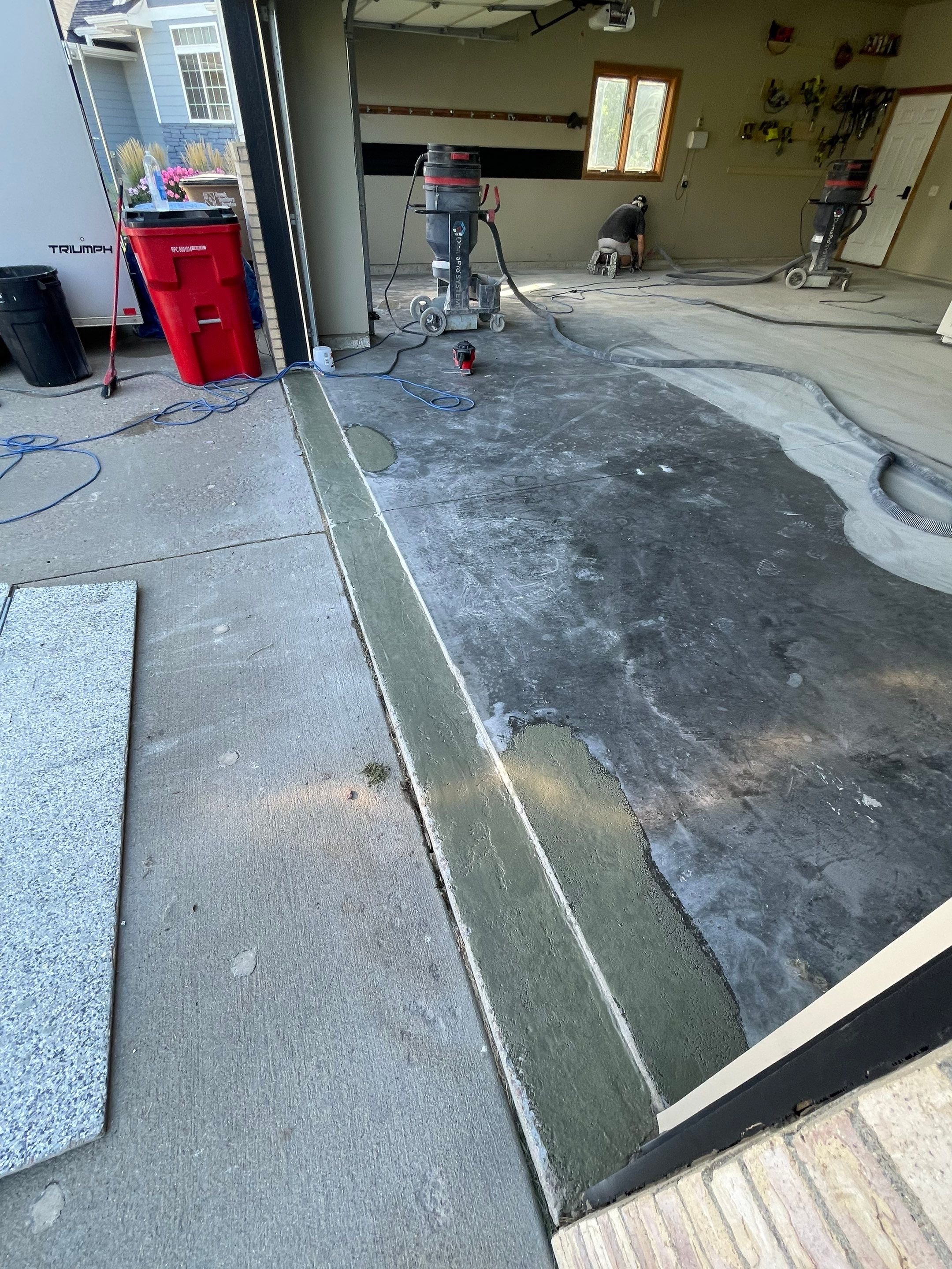 Cabin FEver Flake Garage Floor Coating Installation in Sioux Falls by Select Painting, Coatings & Garage Cabinets