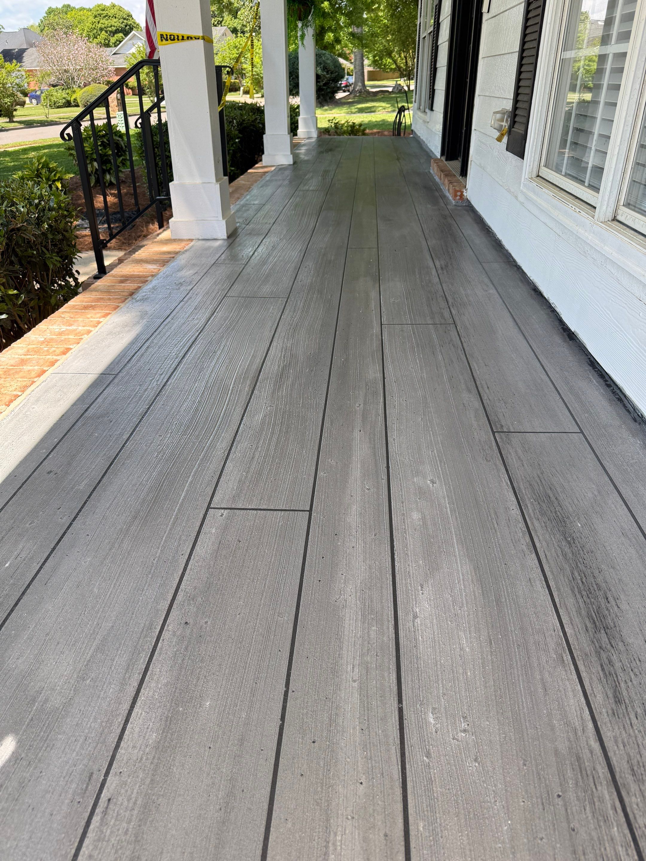 Wood-Grain Stenciled Concrete Porch Resurfacing in Mobile by Cornerstone Hard Surface Restoration 