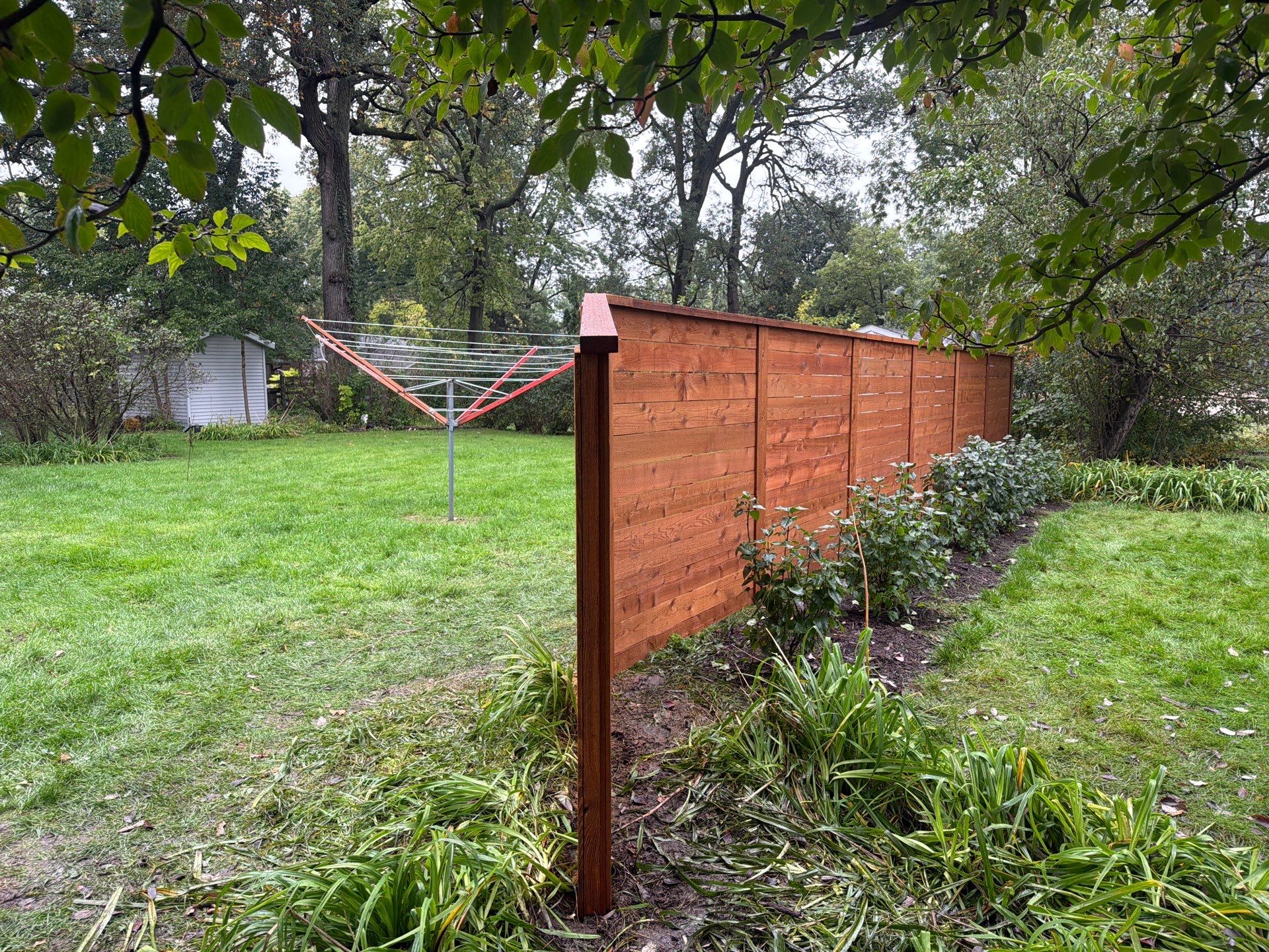 Stained Horizontal Cedar Wood Privacy Fence in Cedar Falls by Perfect Picket Fence and Stain