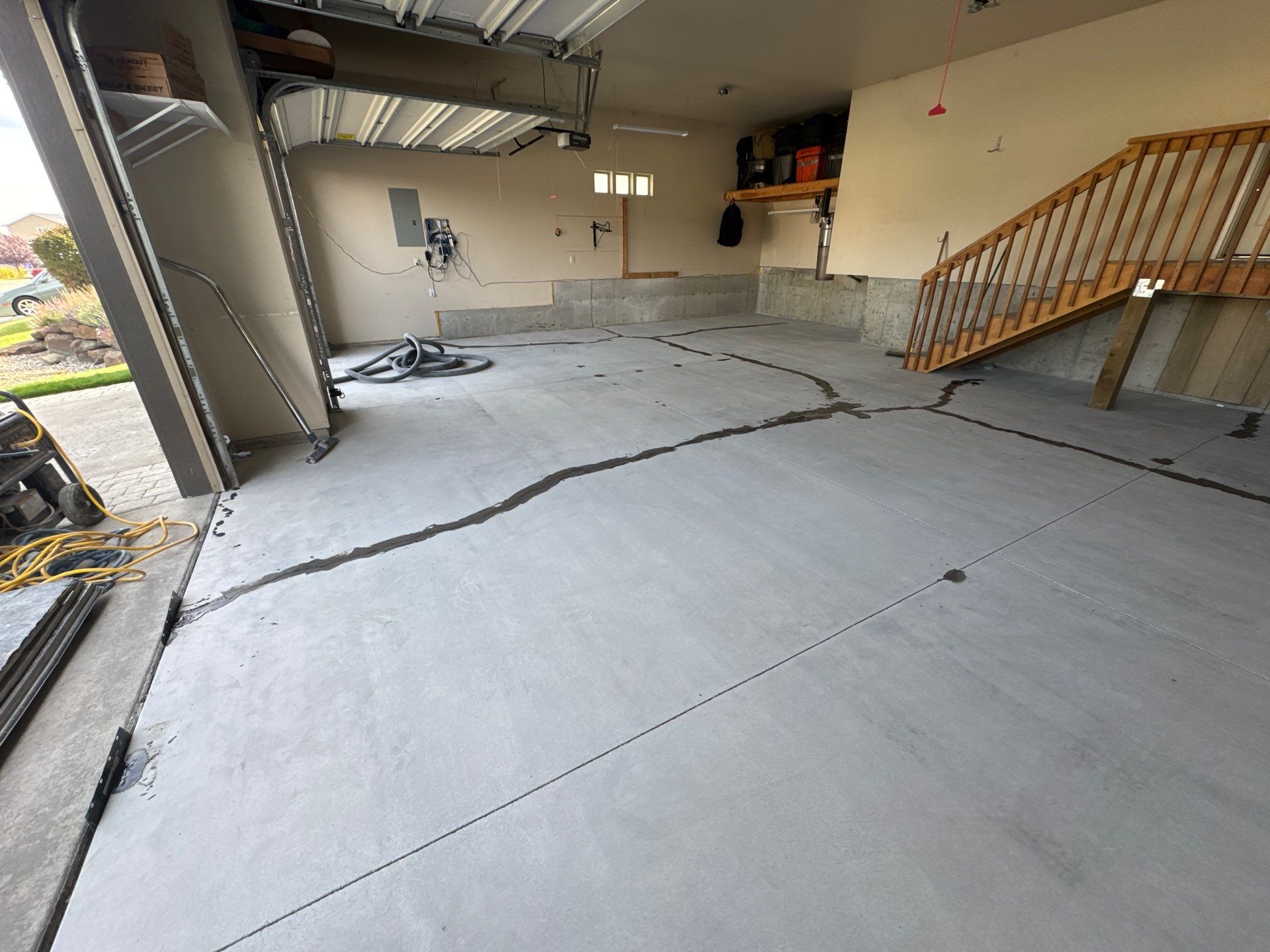 Custom Gray Speckled Polyaspartic Garage Floor Coating in Cheney by Croc Coatings, LLC